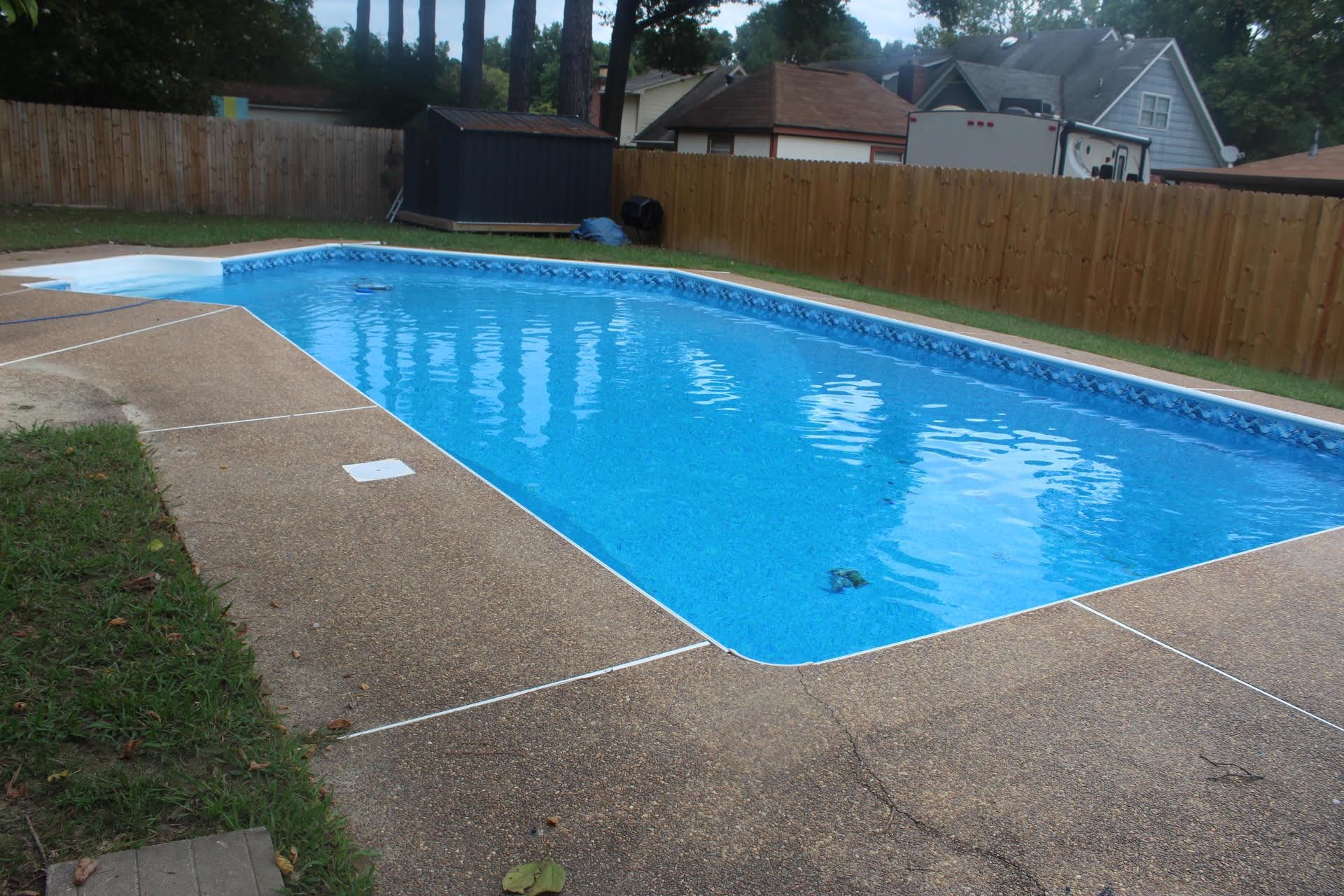 View of swimming pool with a shed