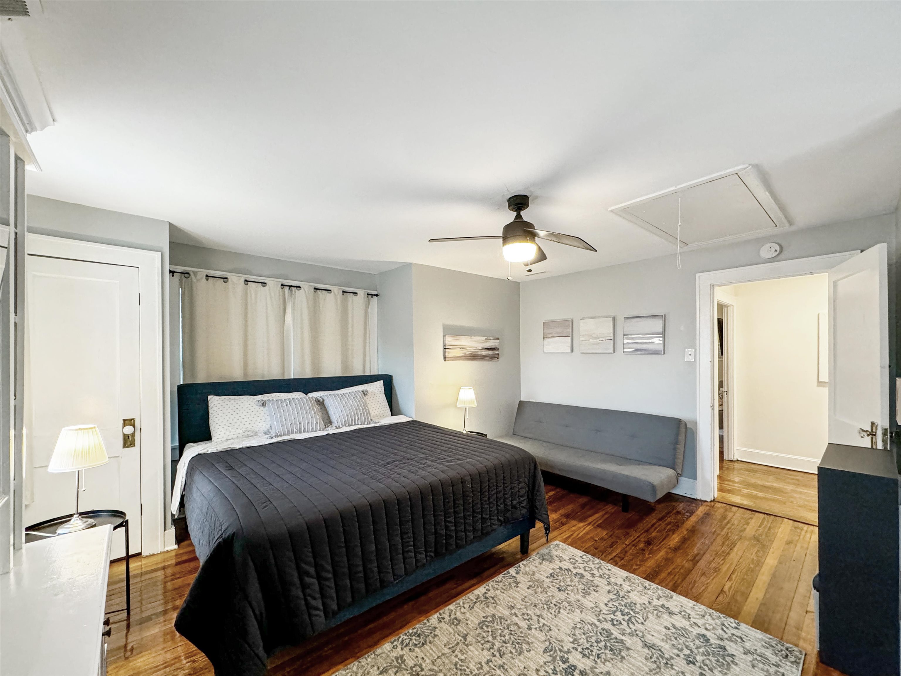 Bedroom featuring ceiling fan and dark hardwood / wood-style flooring