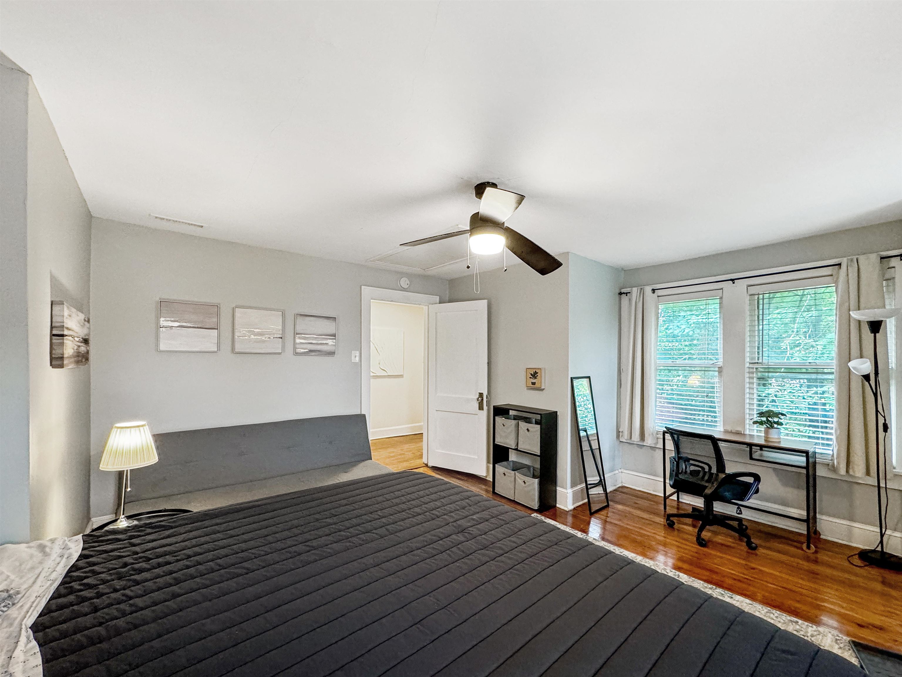 Bedroom featuring ceiling fan and hardwood / wood-style flooring