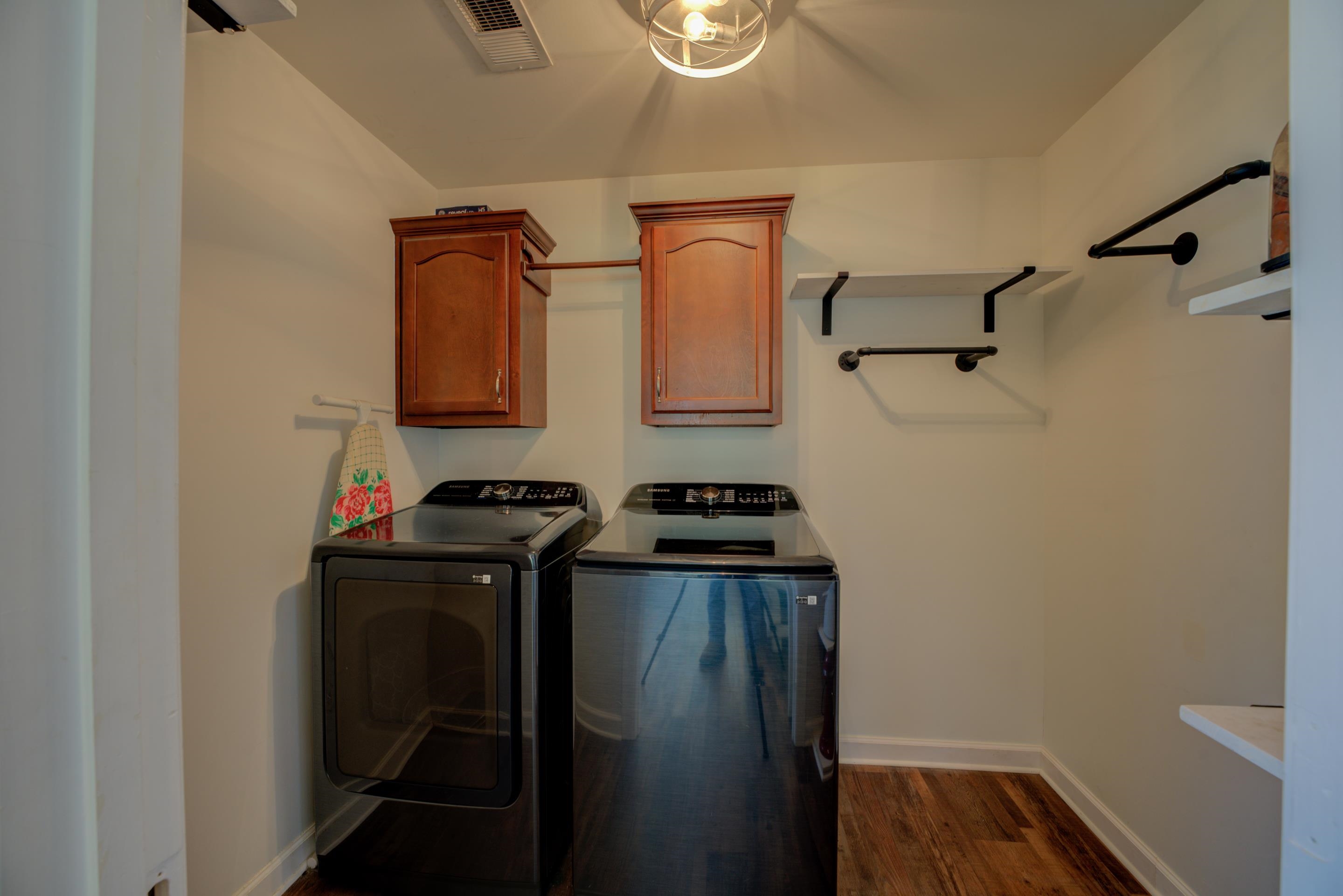 Washroom with cabinets.