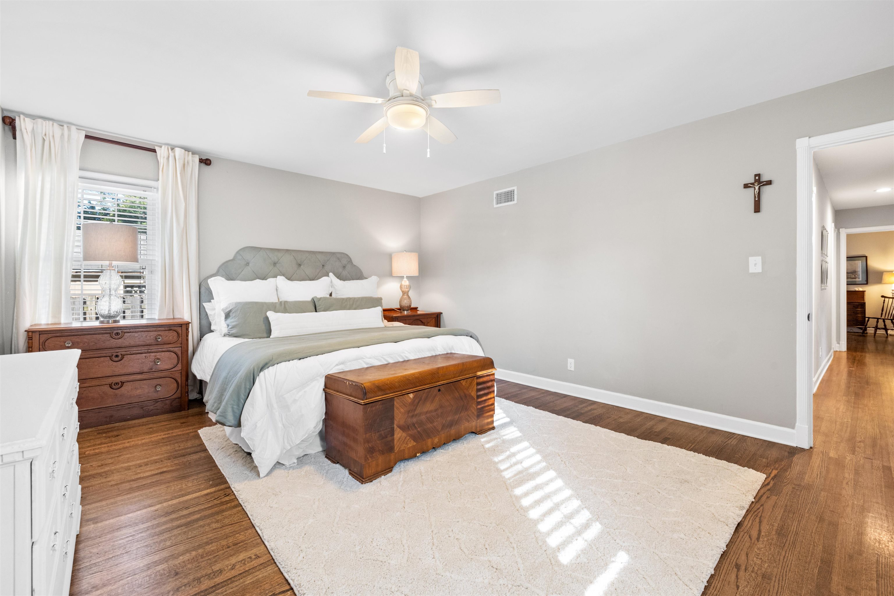 Bedroom featuring dark hardwood / wood-style flooring and ceiling fan