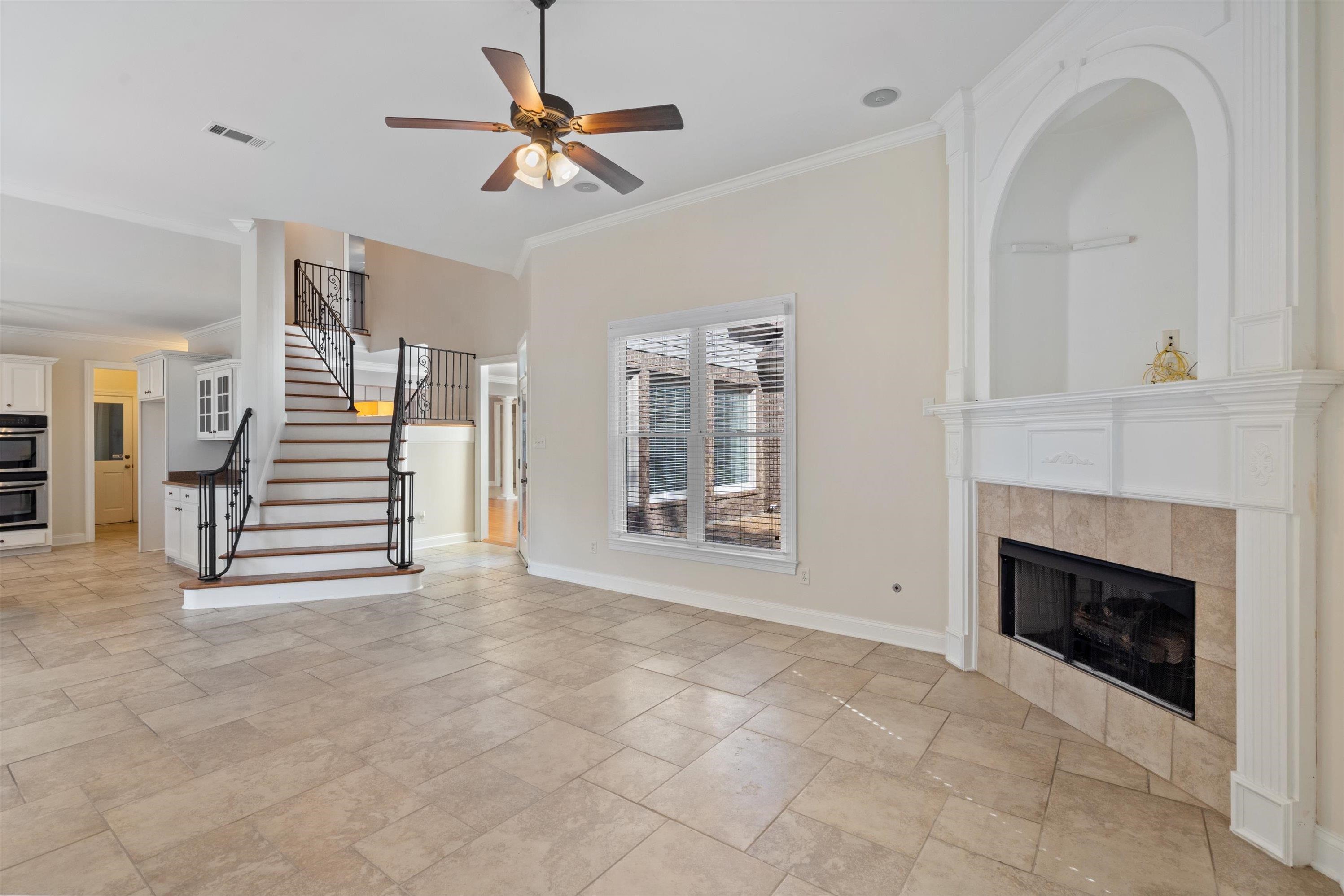 Cozy hearth room with gas fireplace and stairs to second story