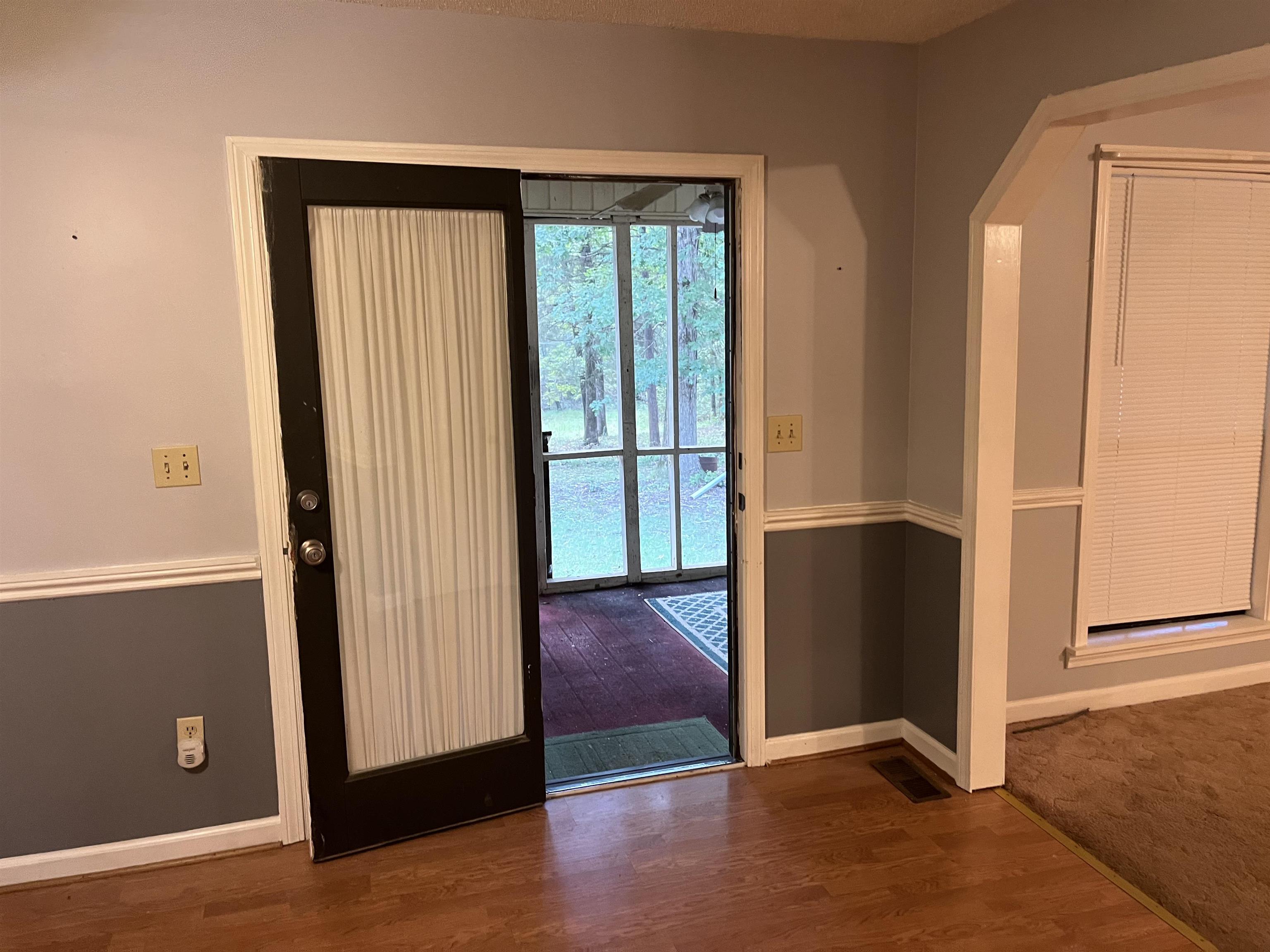 Interior space with dark hardwood / wood-style flooring