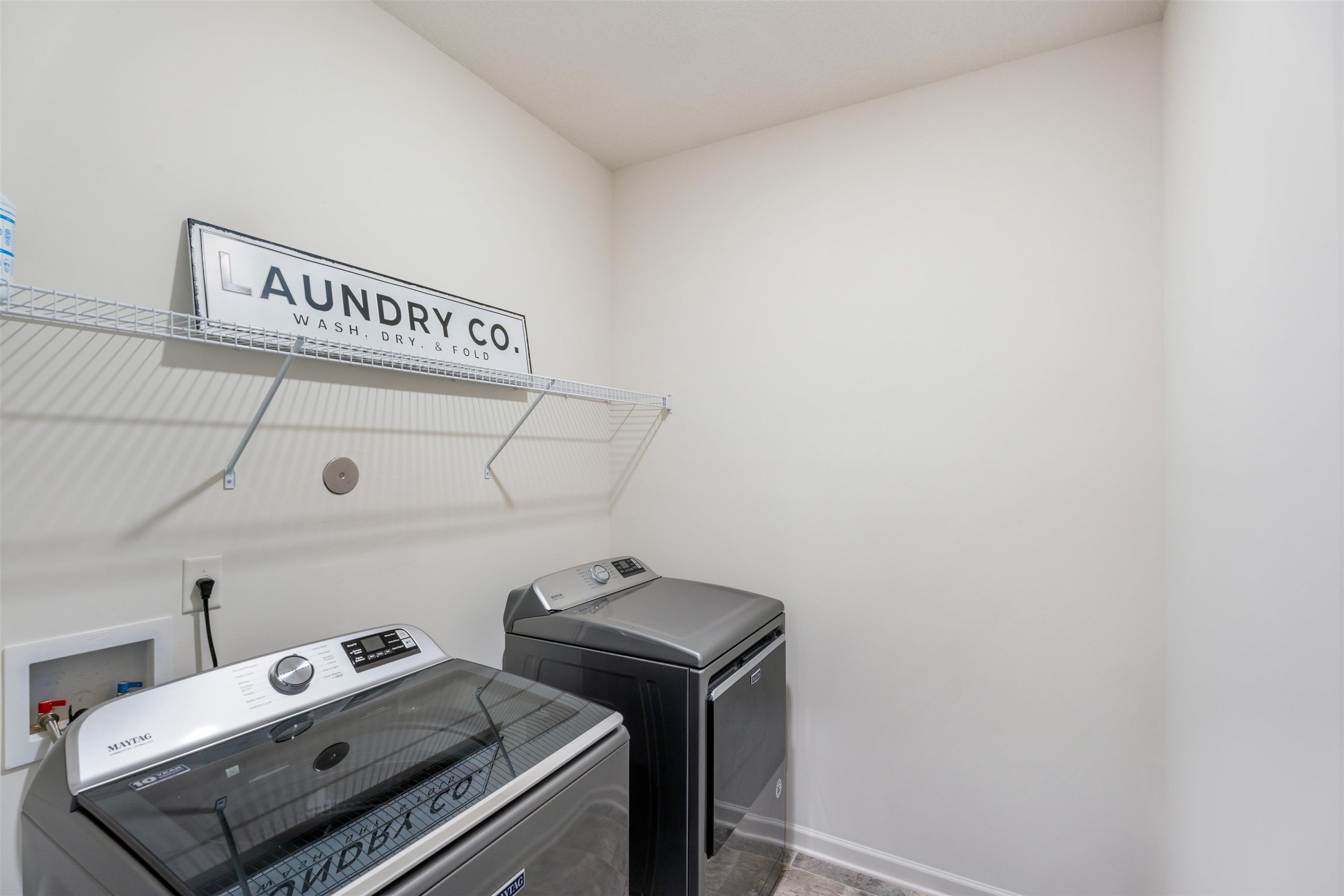 Washroom featuring separate washer and dryer