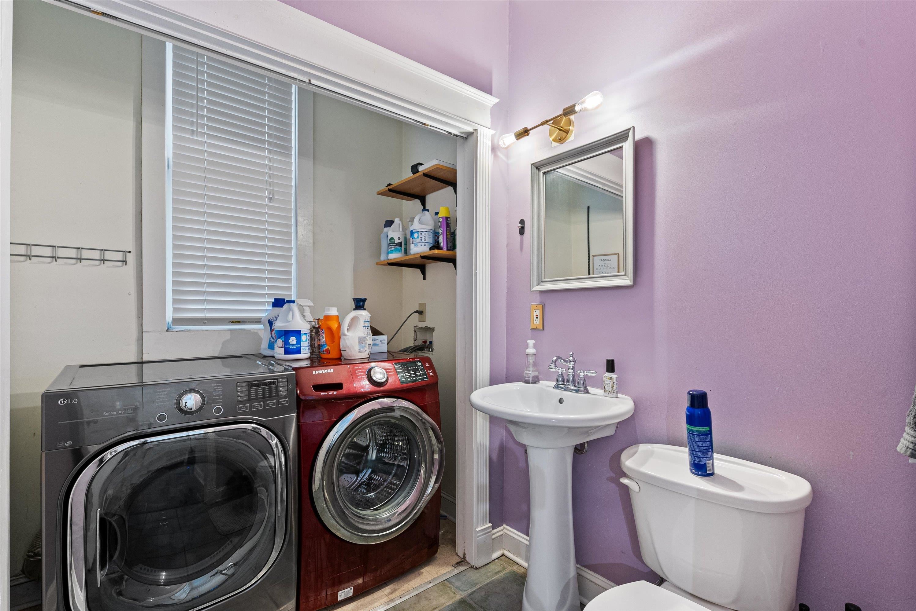 Washroom featuring sink and washer and dryer