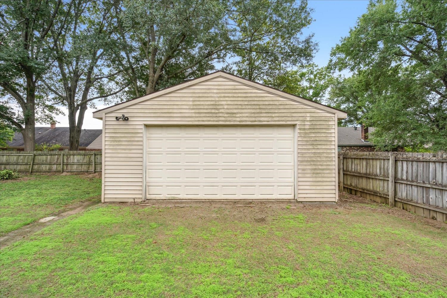 Garage featuring a yard