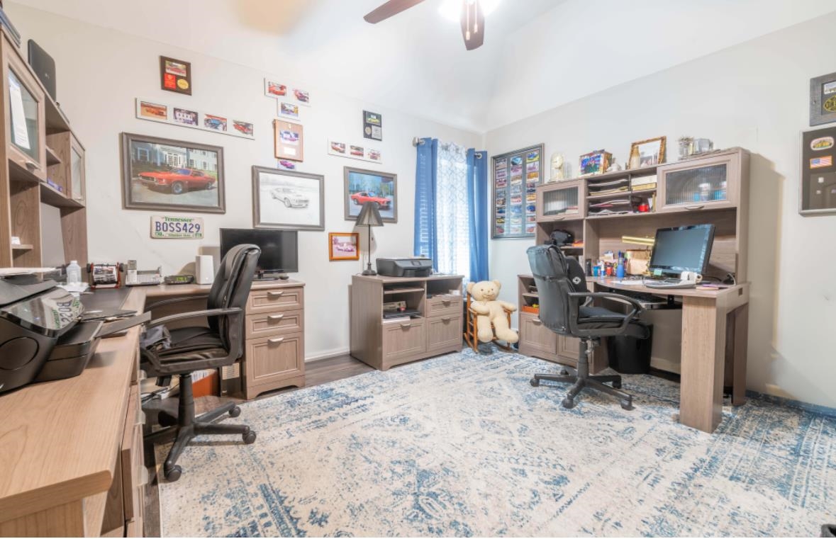 Office area featuring ceiling fan and light hardwood / wood-style floors