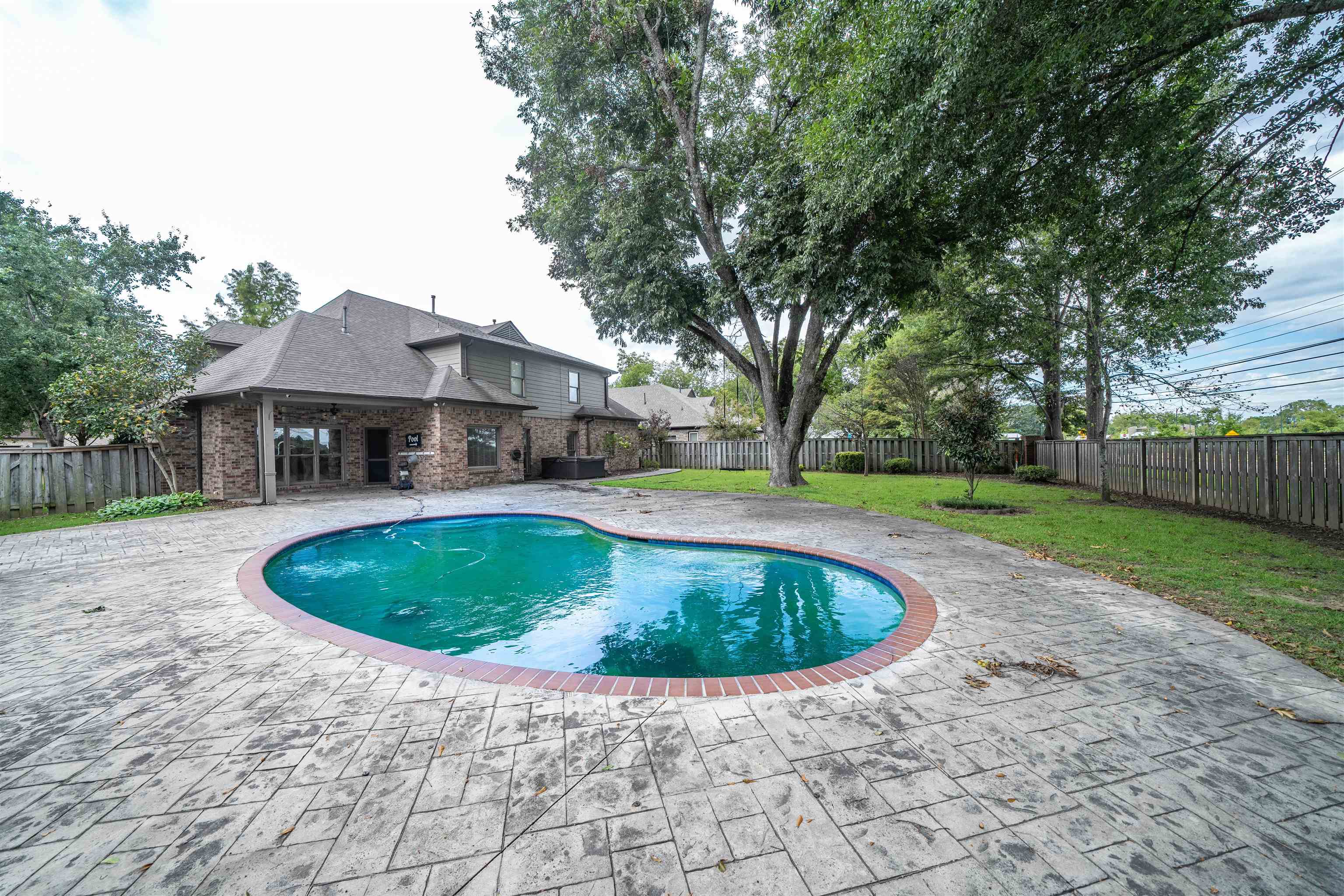 View of pool featuring a patio and a yard