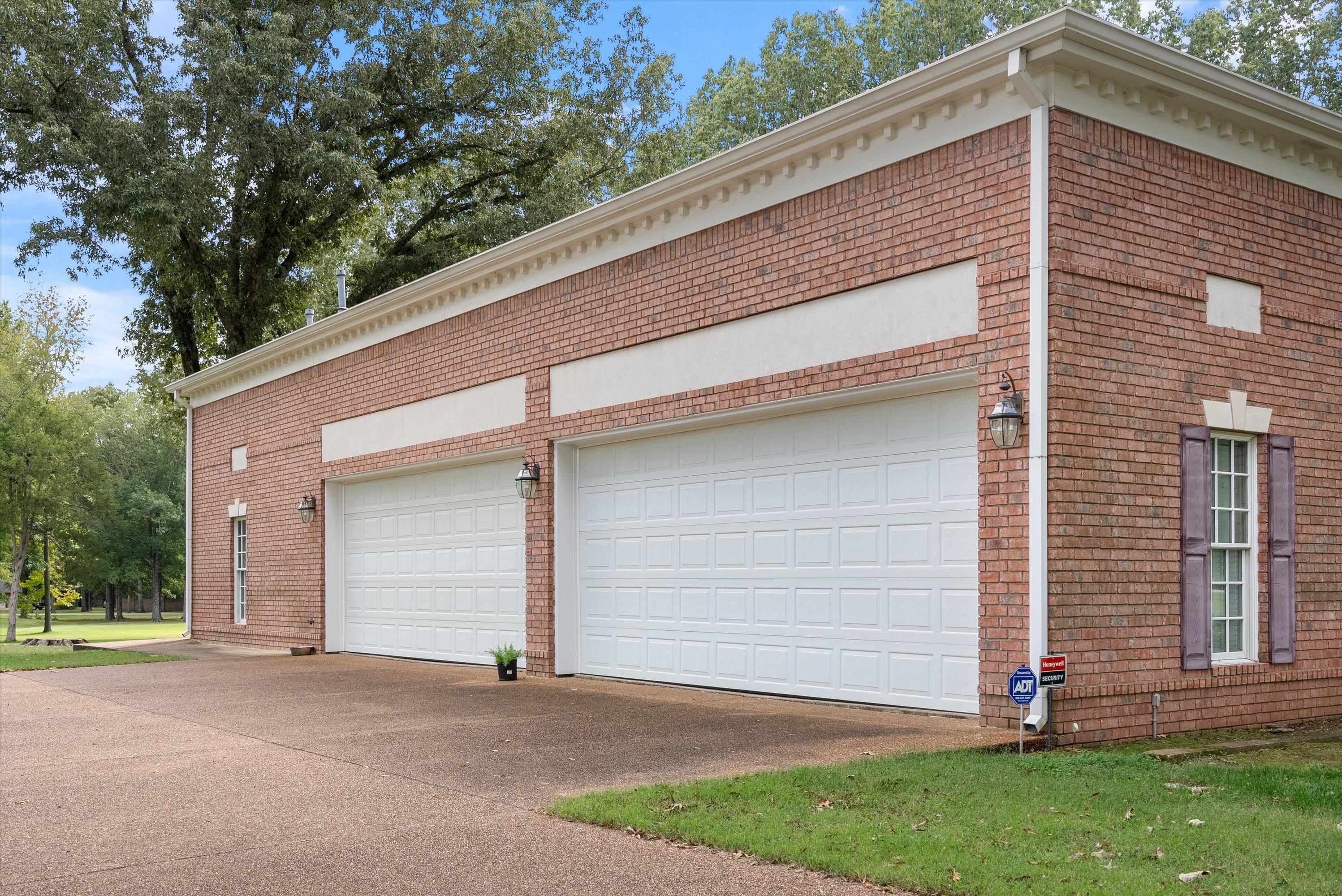 View of garage two tall insulated dbl doors