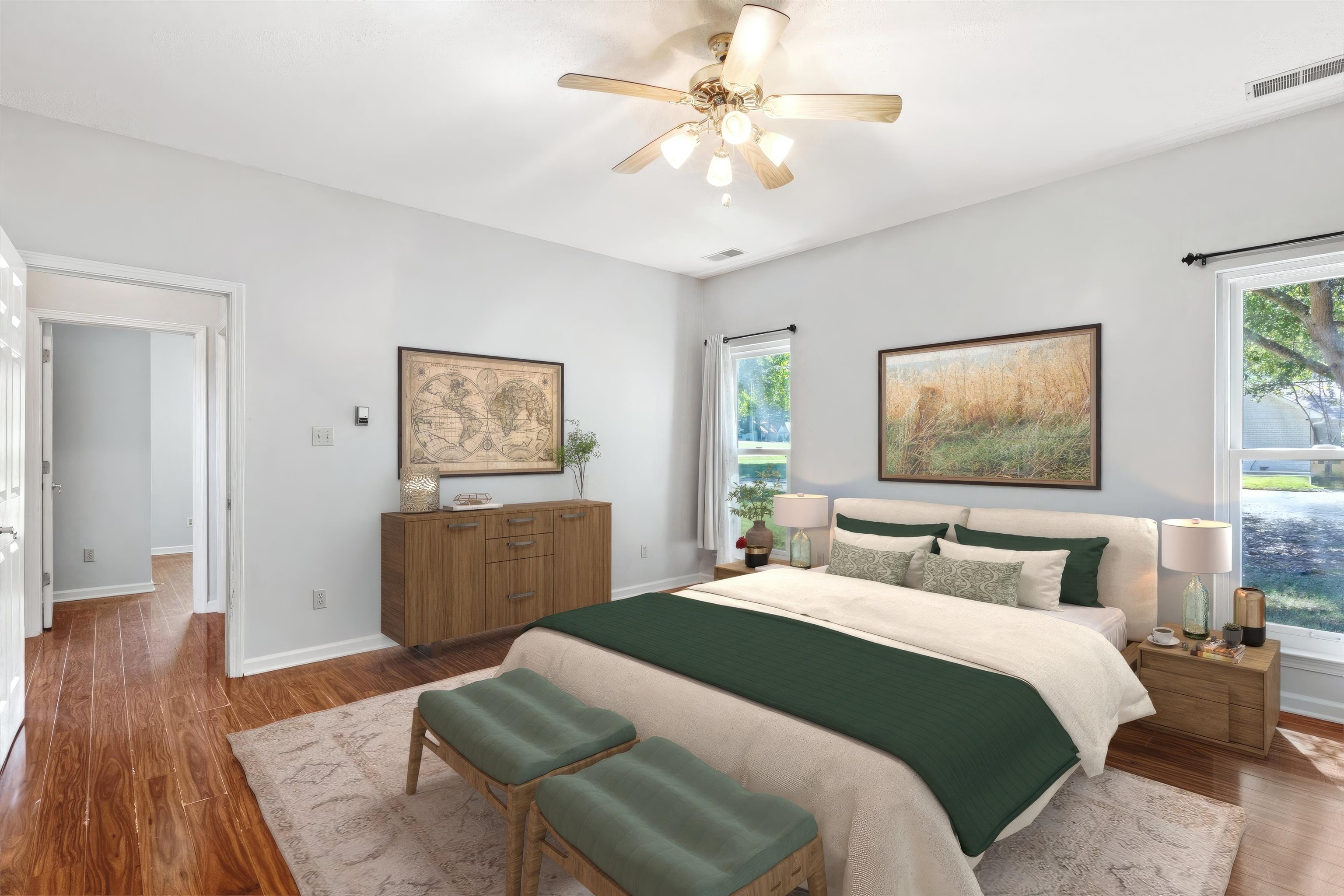 Bedroom with hardwood / wood-style floors and ceiling fan