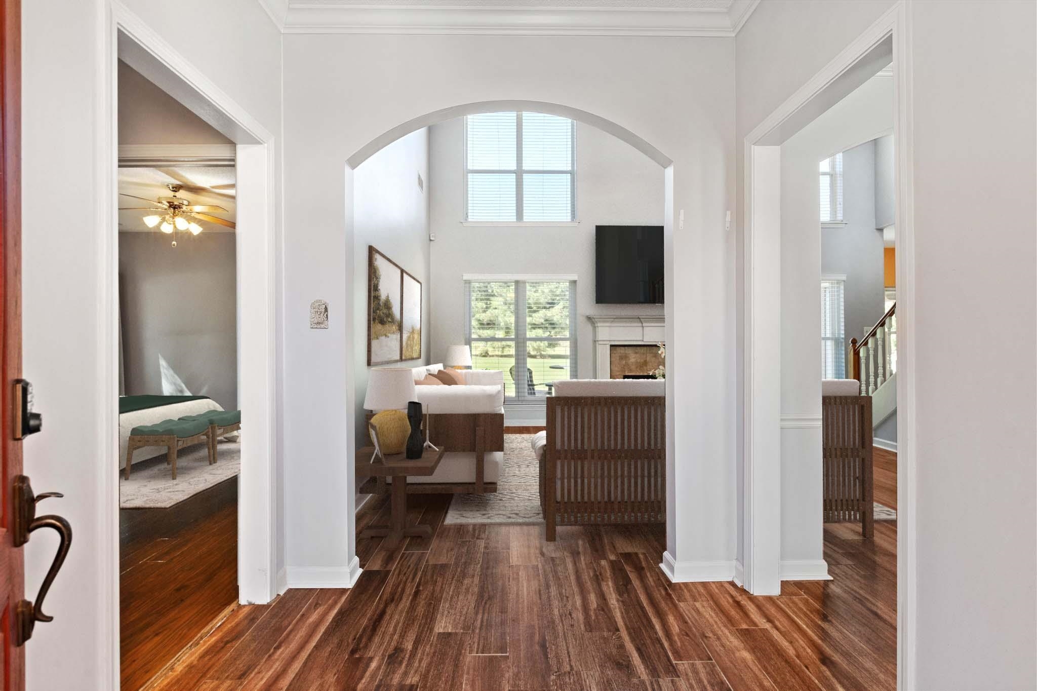 Entryway featuring crown molding, dark hardwood / wood-style floors, and ceiling fan