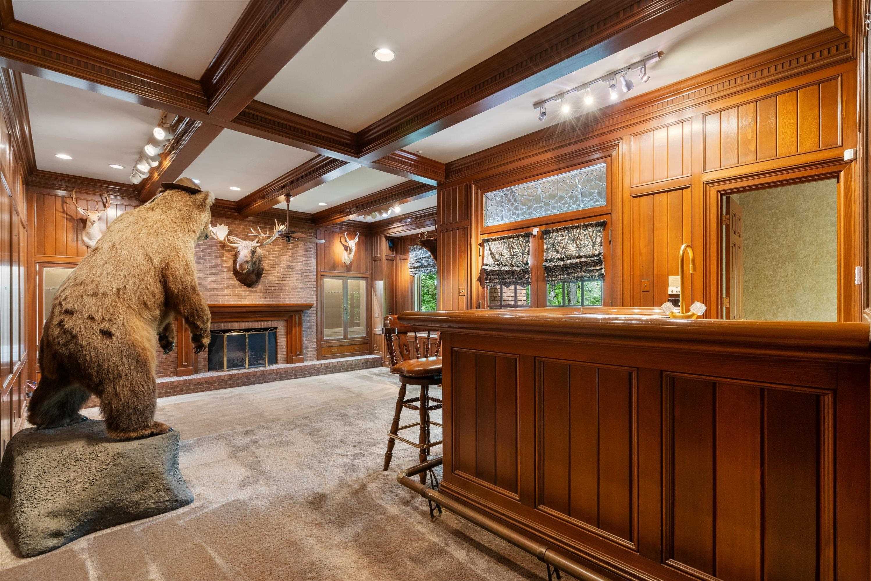 Impressive Trophy Room / Man Cave with Full Bar and double doors to a cigar patio  Public