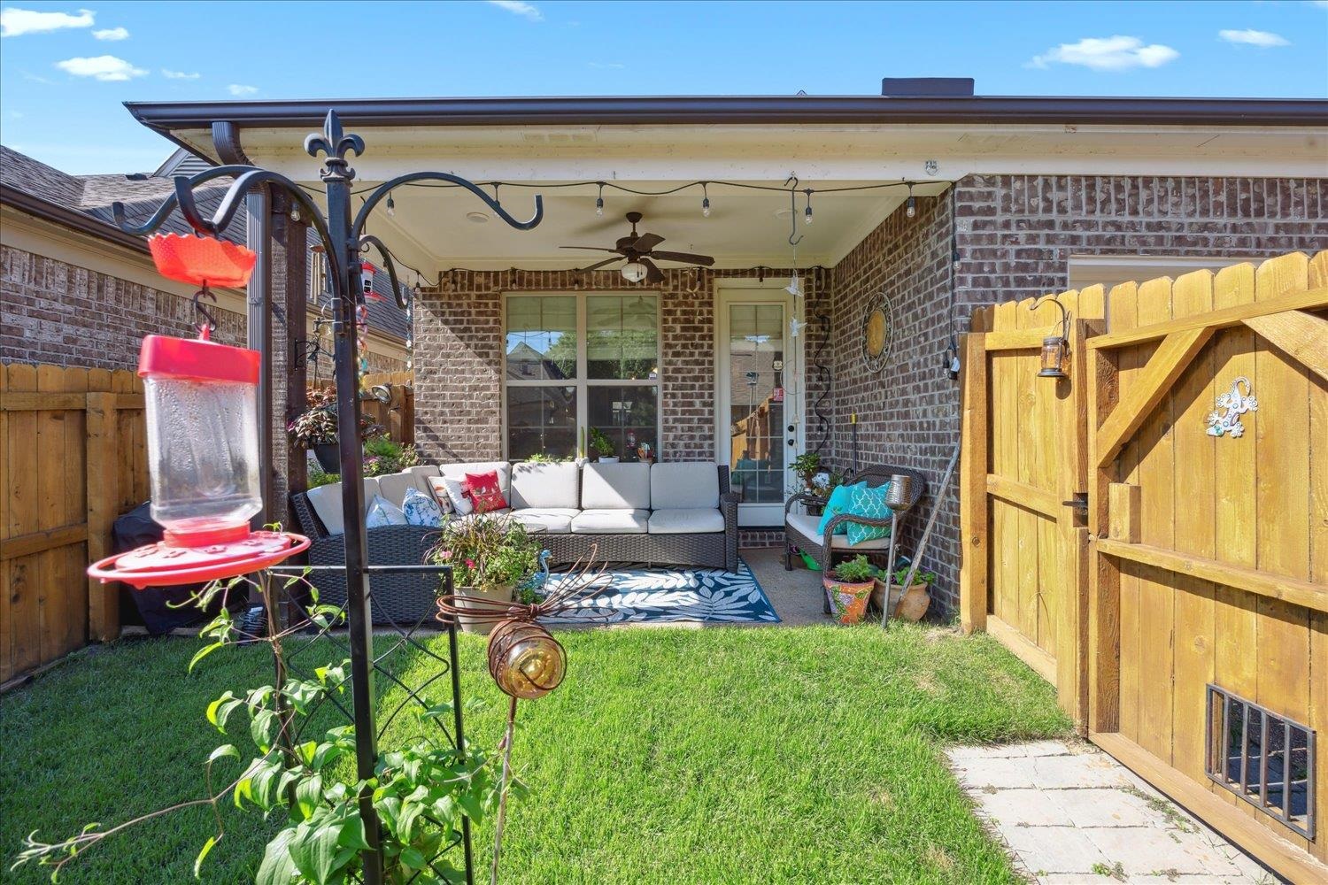 View of patio with ceiling fan and an outdoor living space