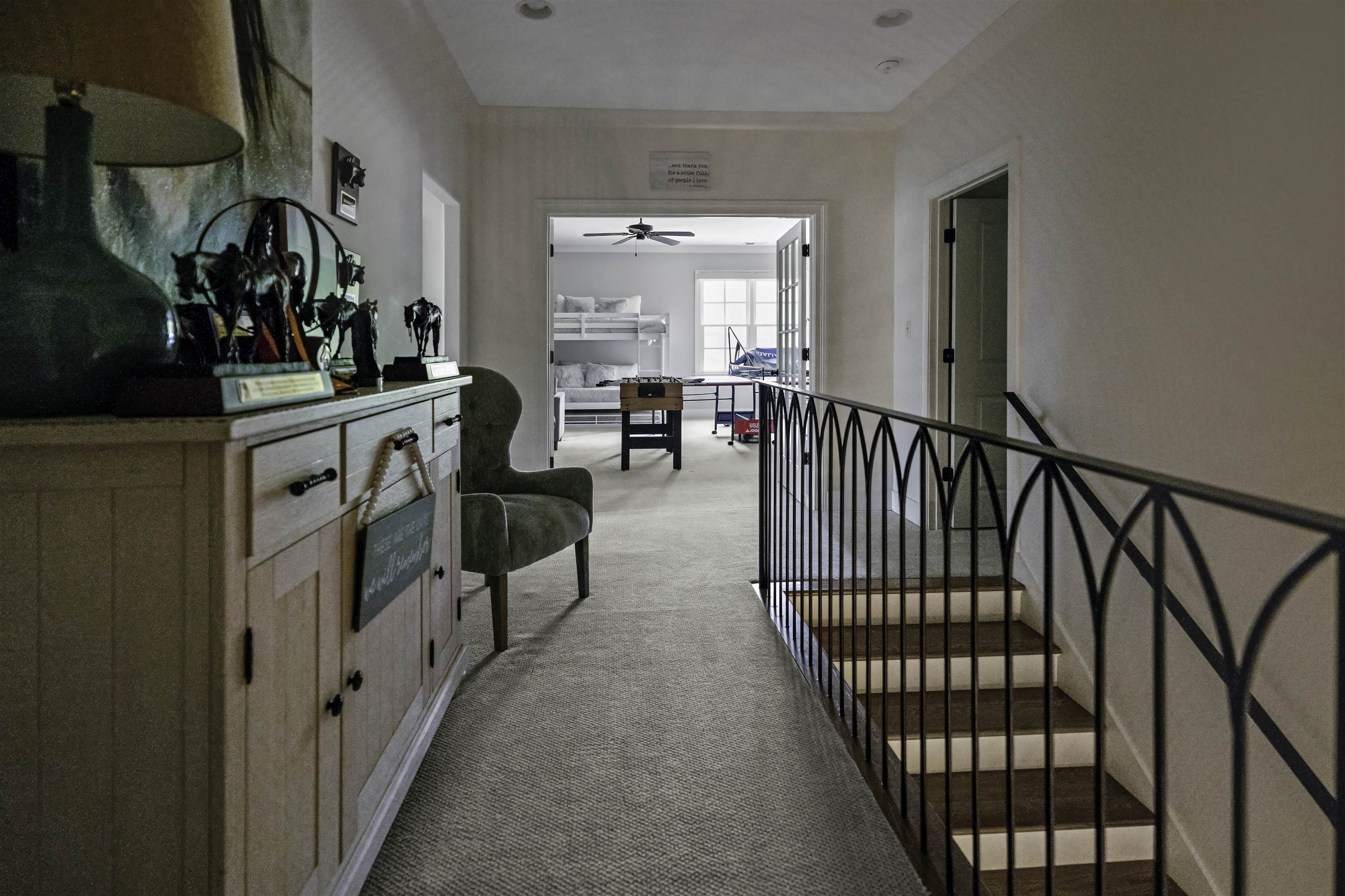 Corridor with light colored carpet