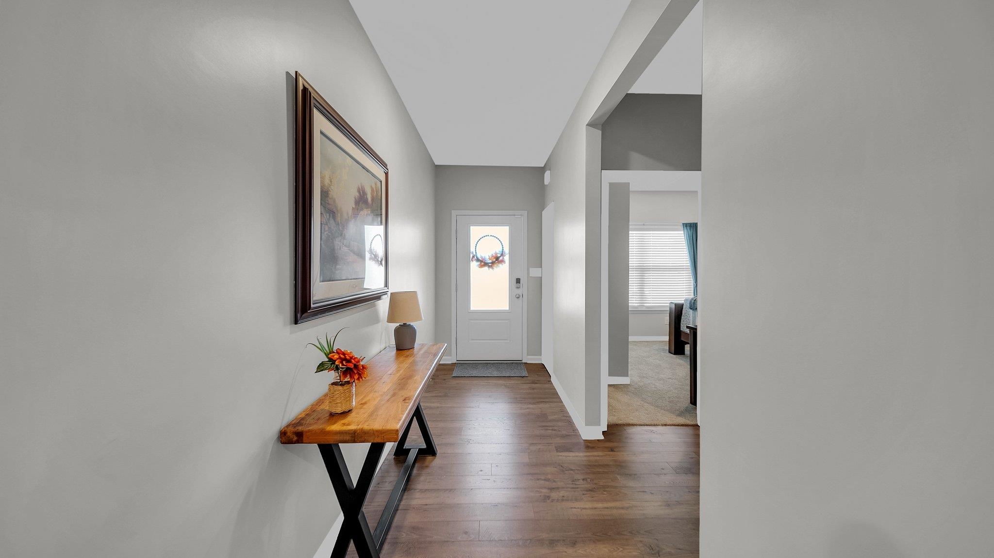 Foyer entrance with dark wood-type flooring