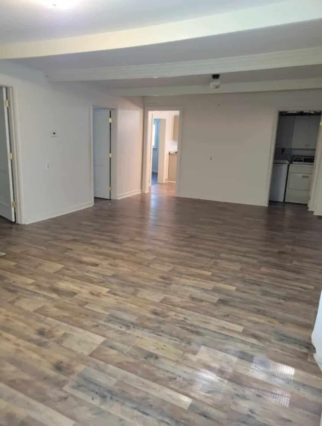 Empty room featuring wood-type flooring