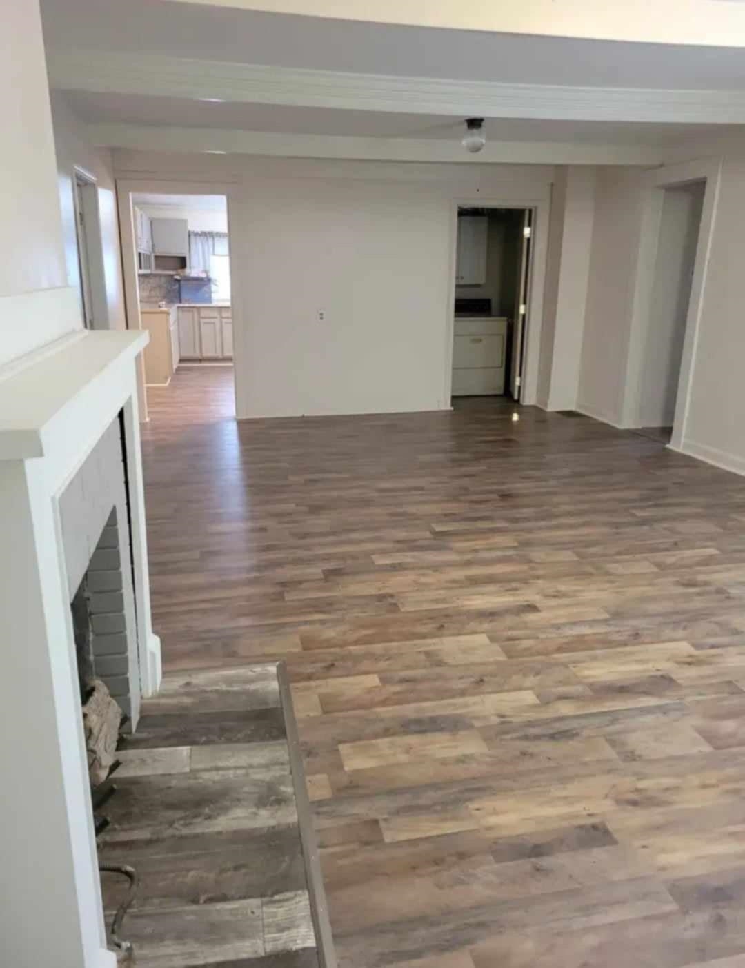 Unfurnished living room with dark hardwood / wood-style flooring