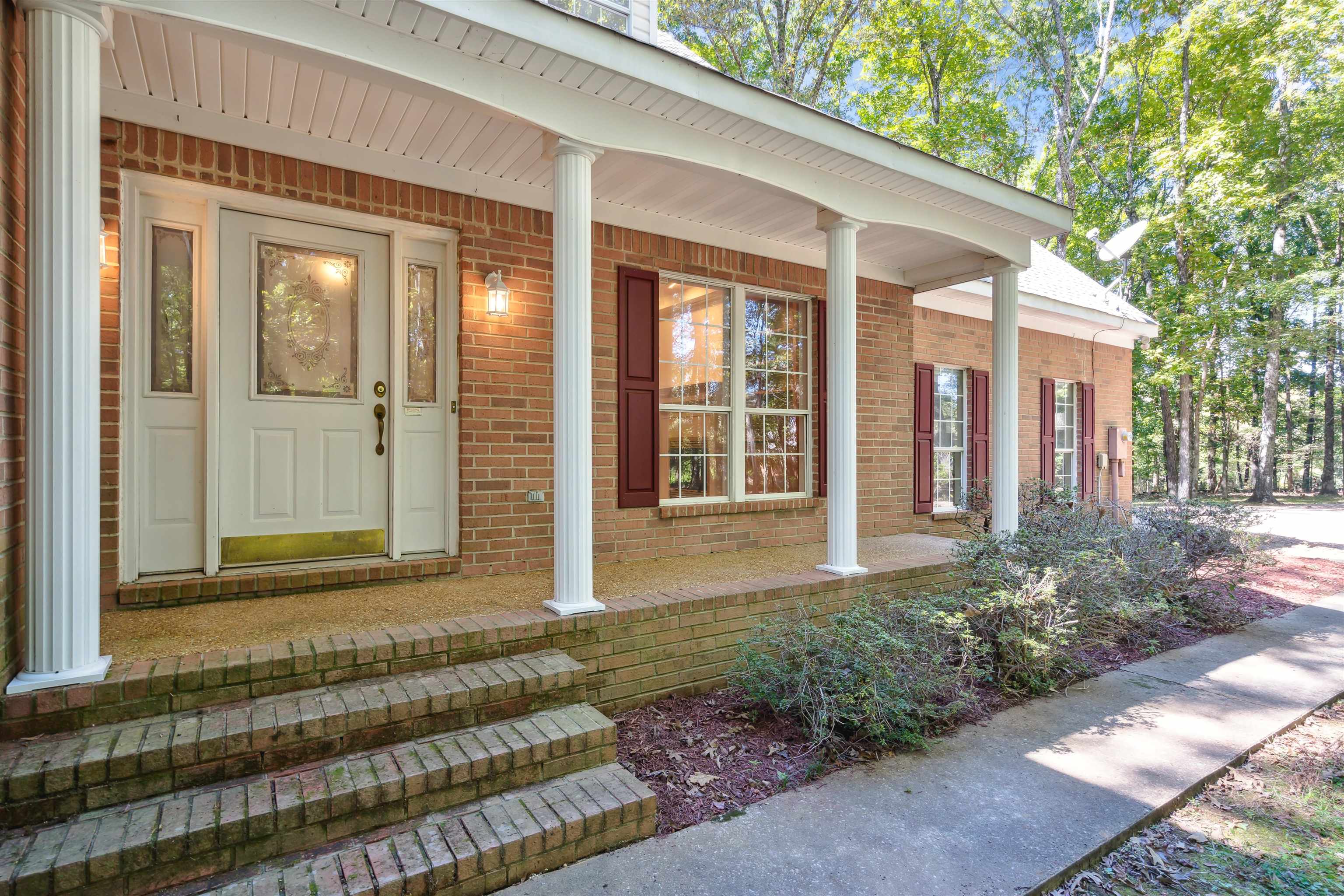 Property entrance featuring covered porch