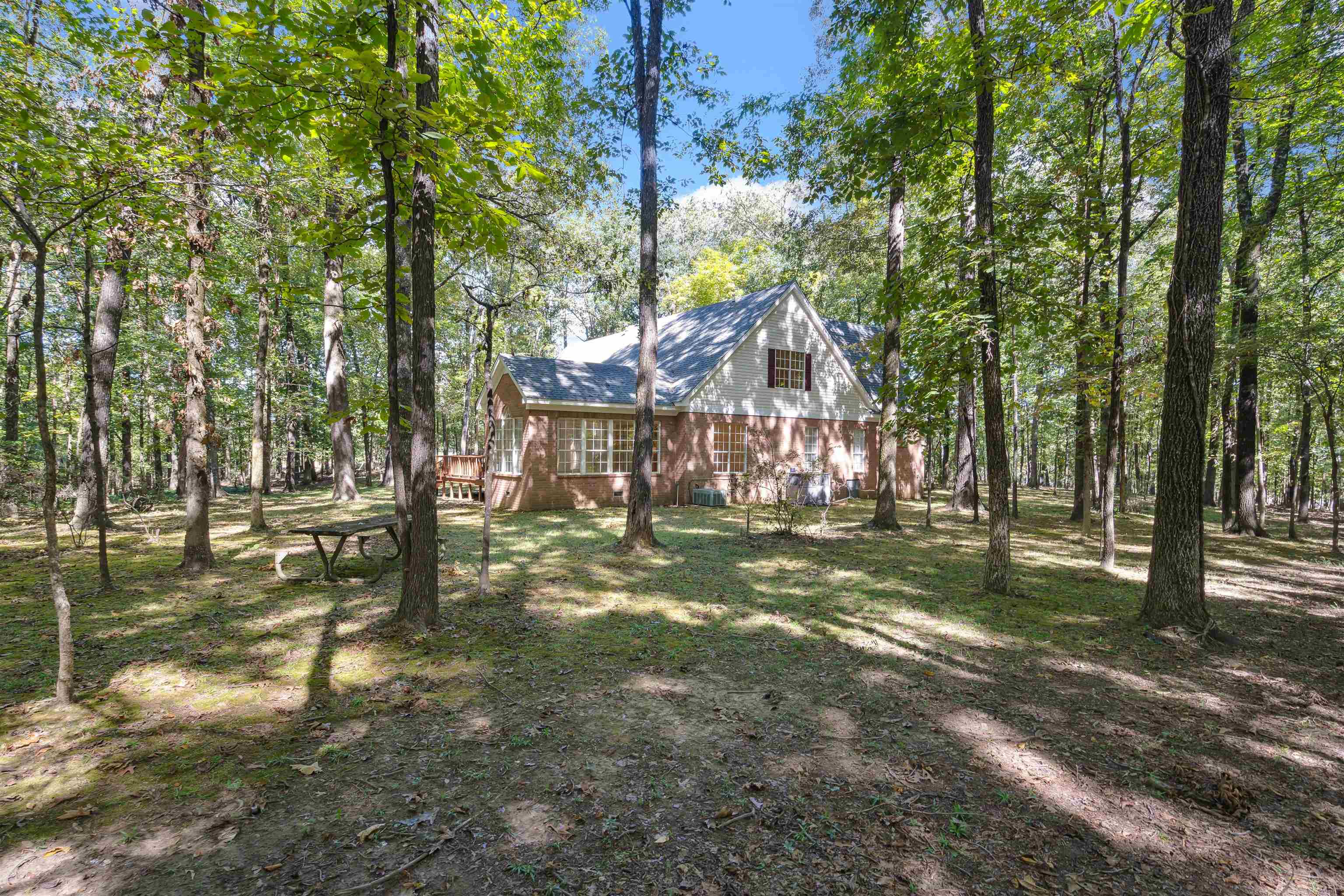View of yard featuring a wooden deck