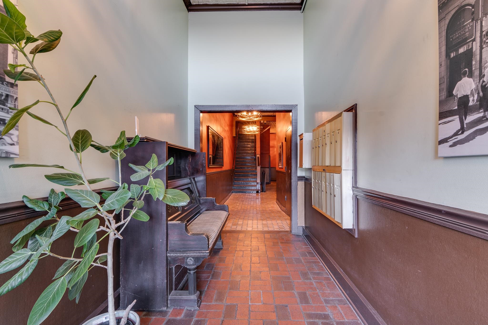 Hallway with a chandelier and a high ceiling