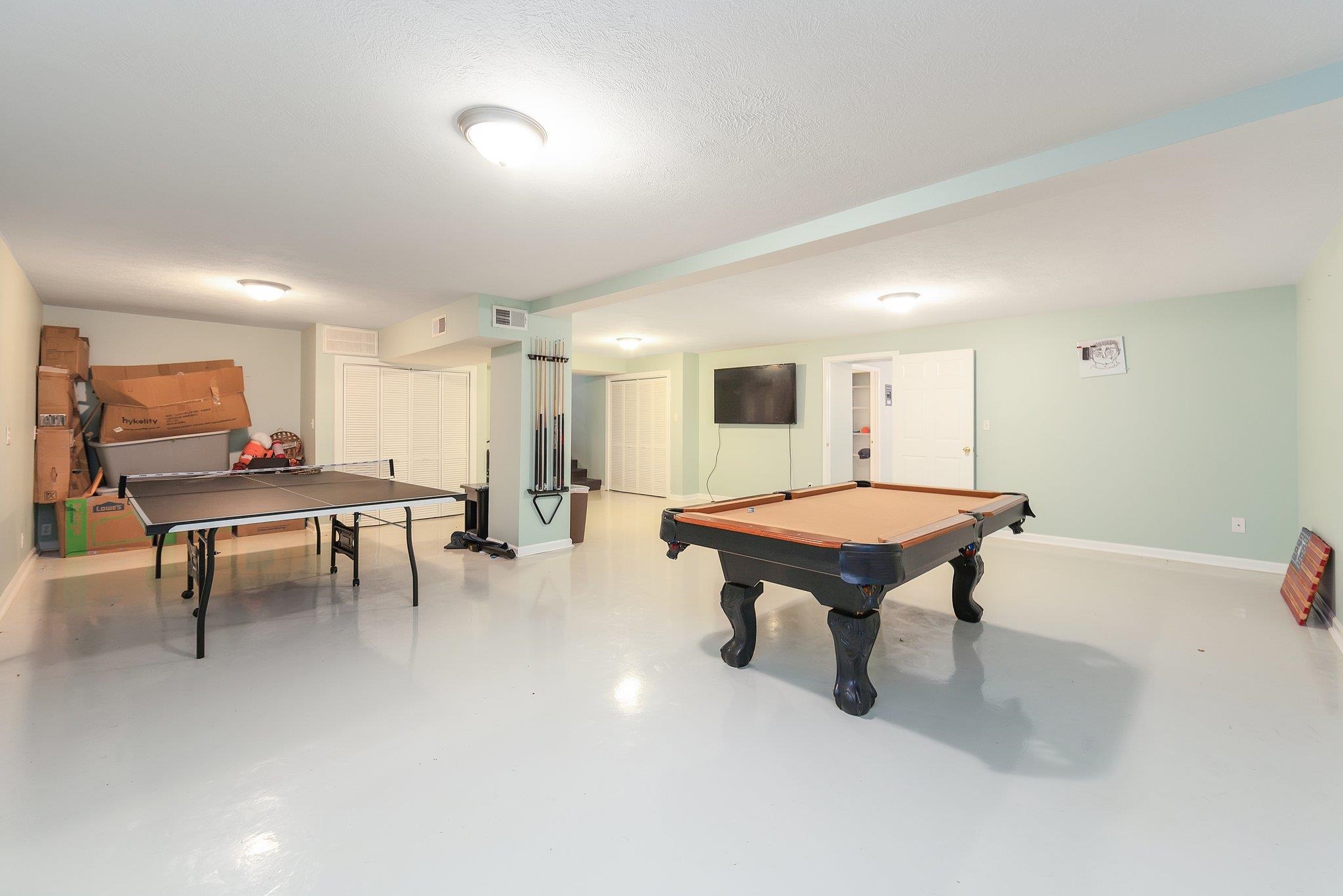 Rec room with a textured ceiling and billiards