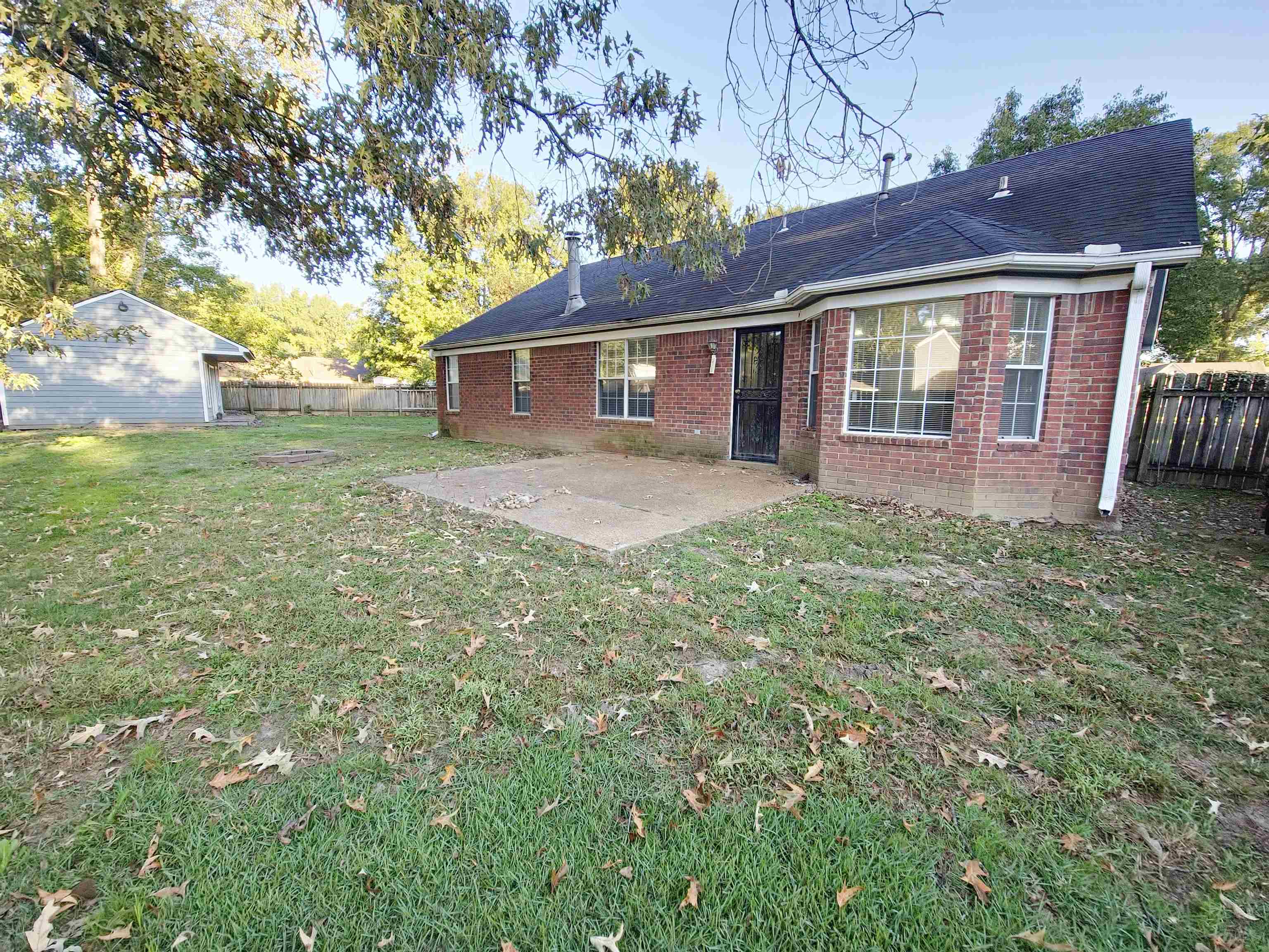 Back of house featuring a yard and a patio