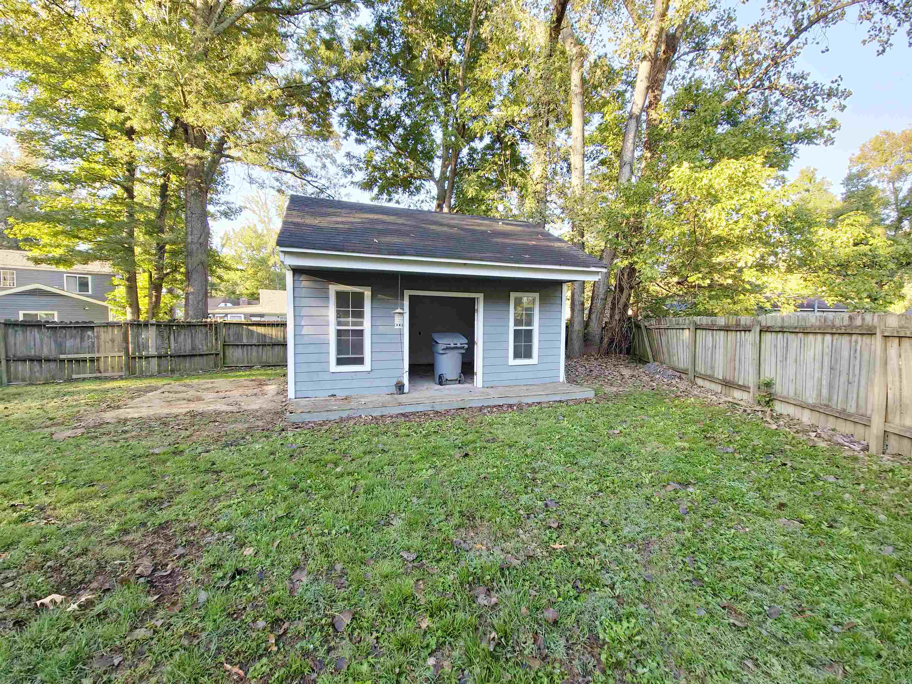 View of outbuilding featuring a yard