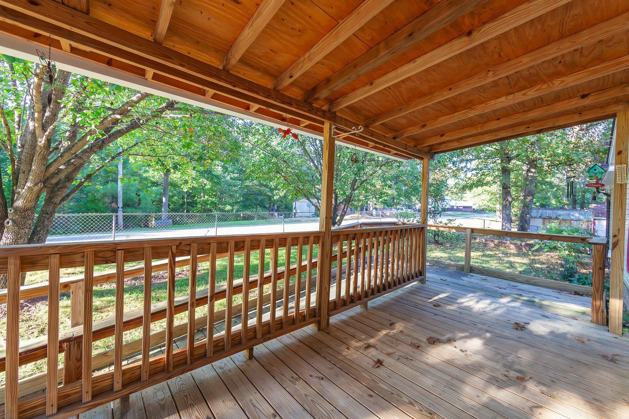 Wooden terrace with a yard