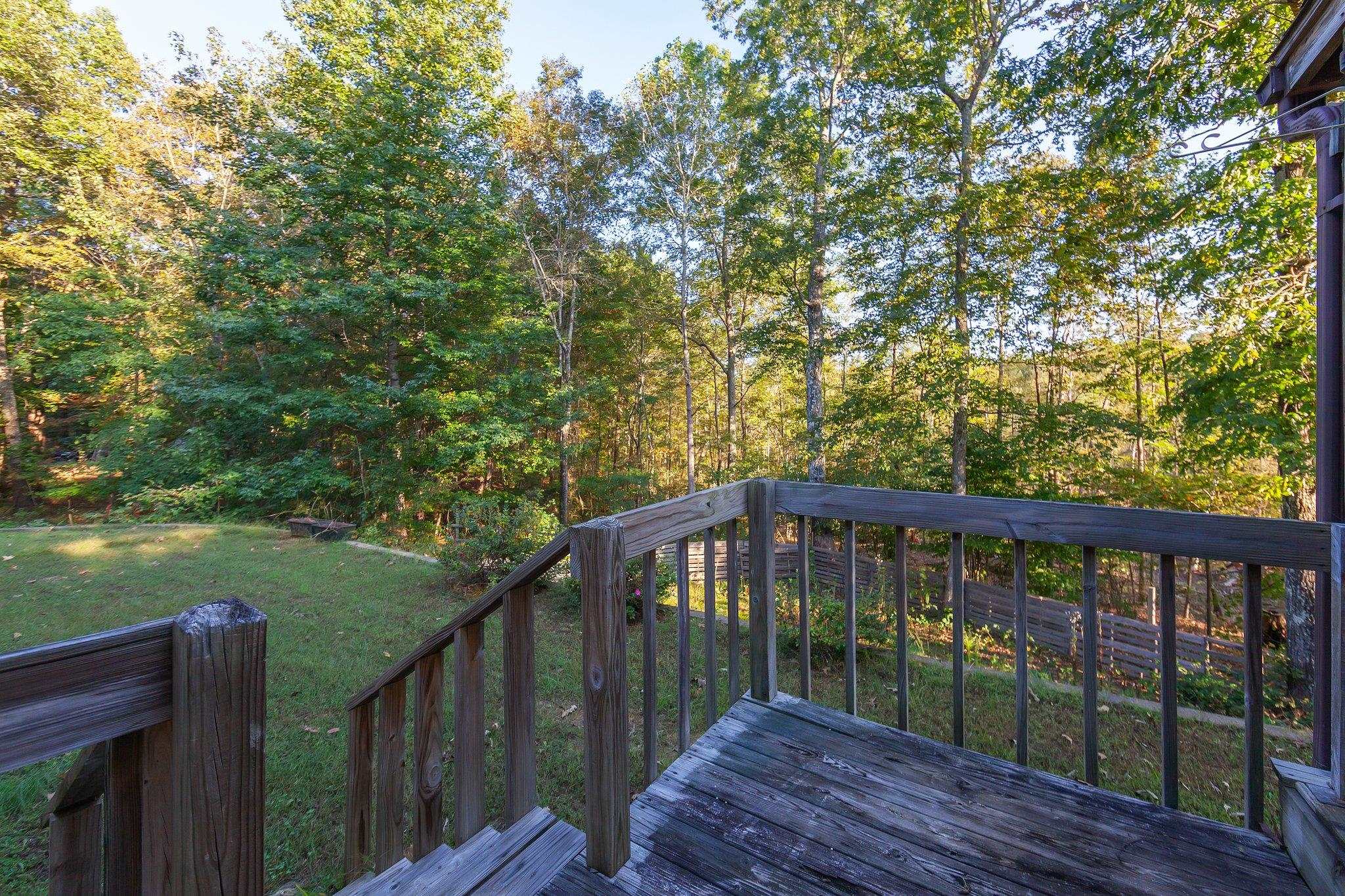 Deck featuring a lawn