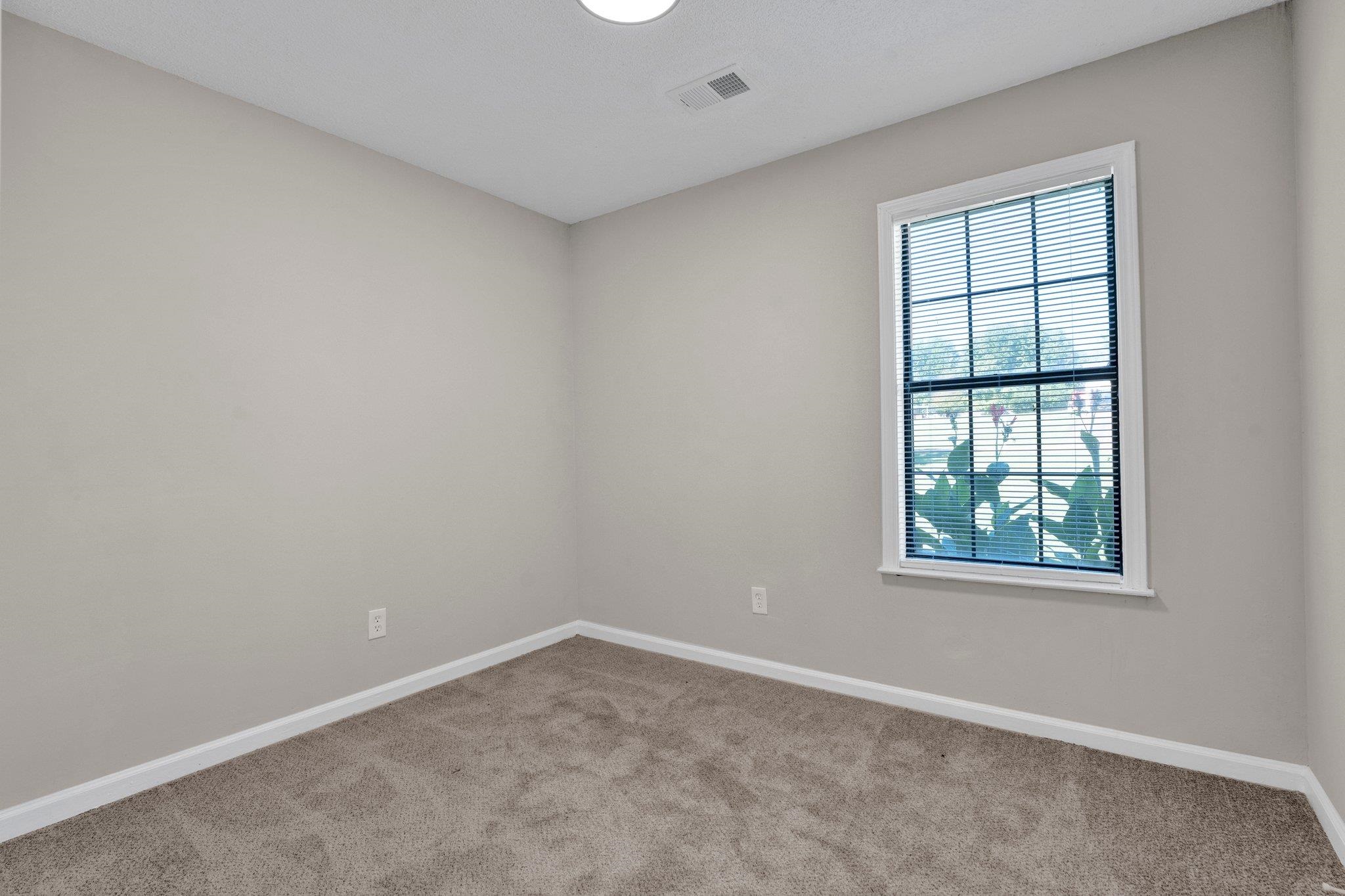 Unfurnished room featuring carpet flooring