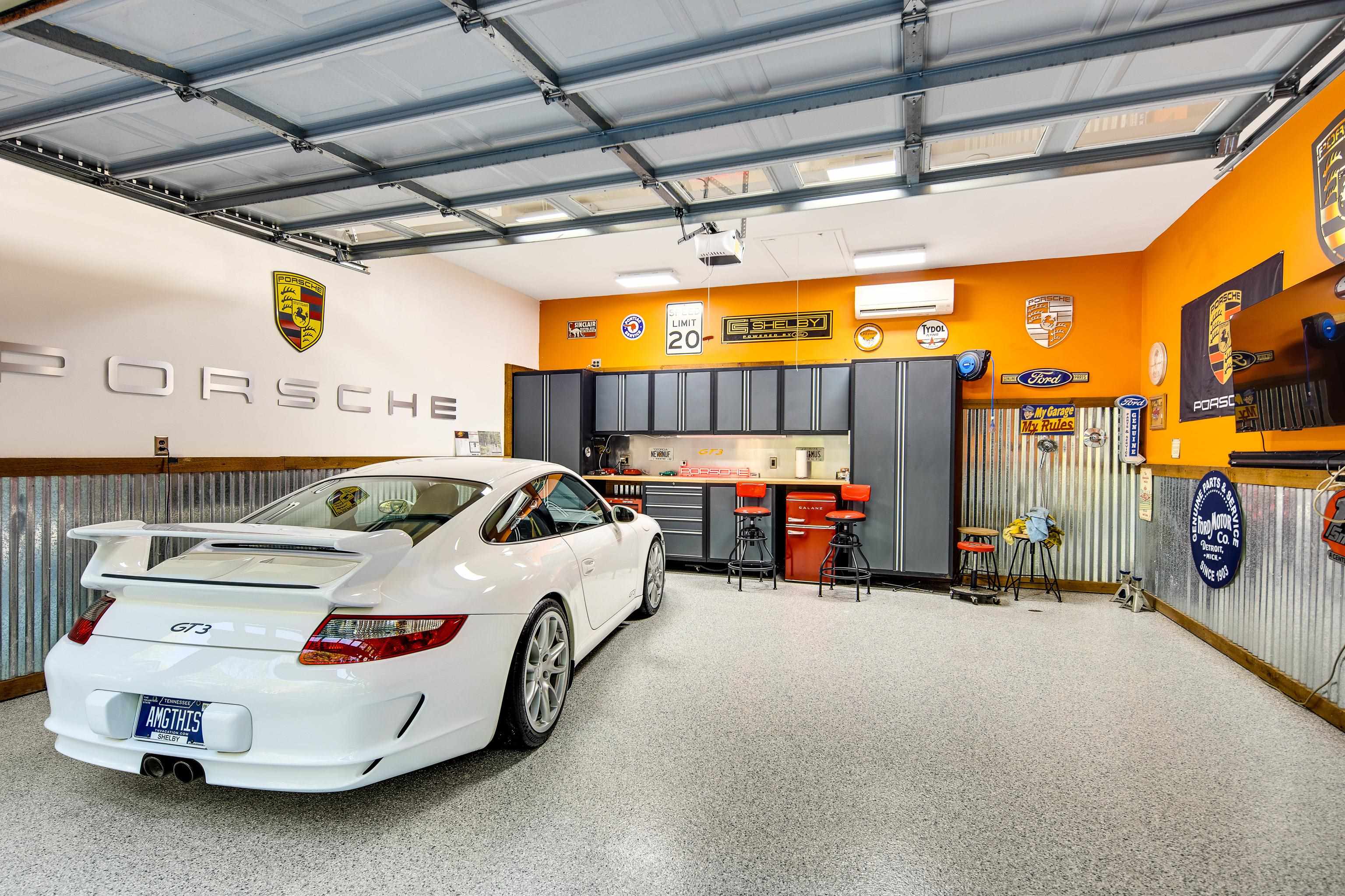 Garage with a garage door opener and a wall unit AC