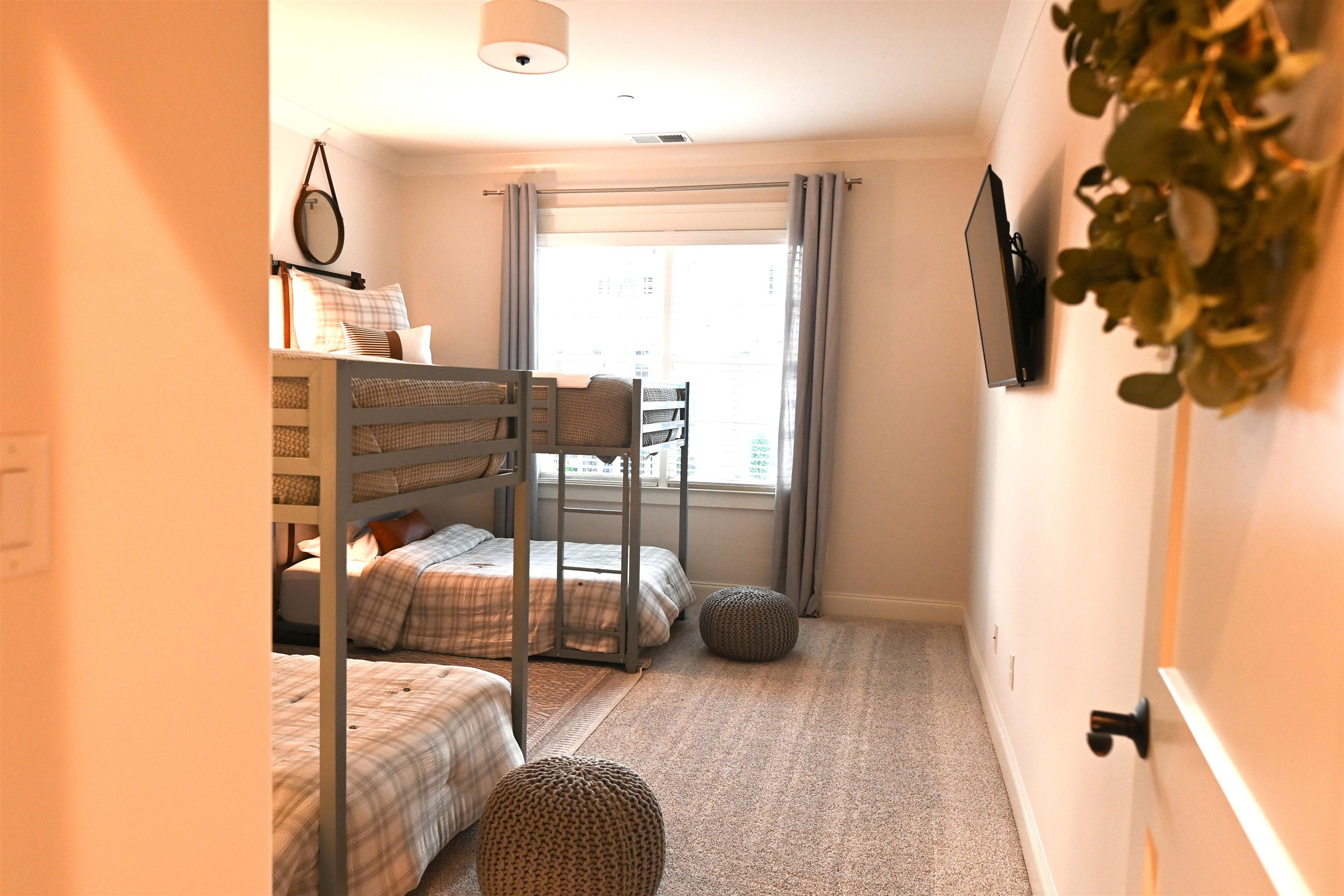 Carpeted bedroom featuring ornamental molding