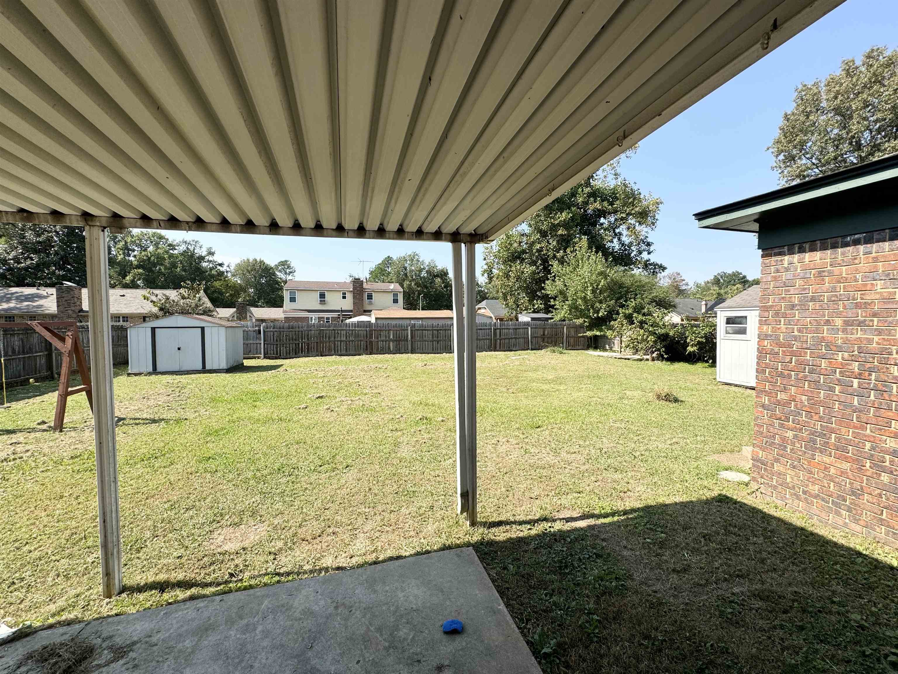 View of yard with a storage shed