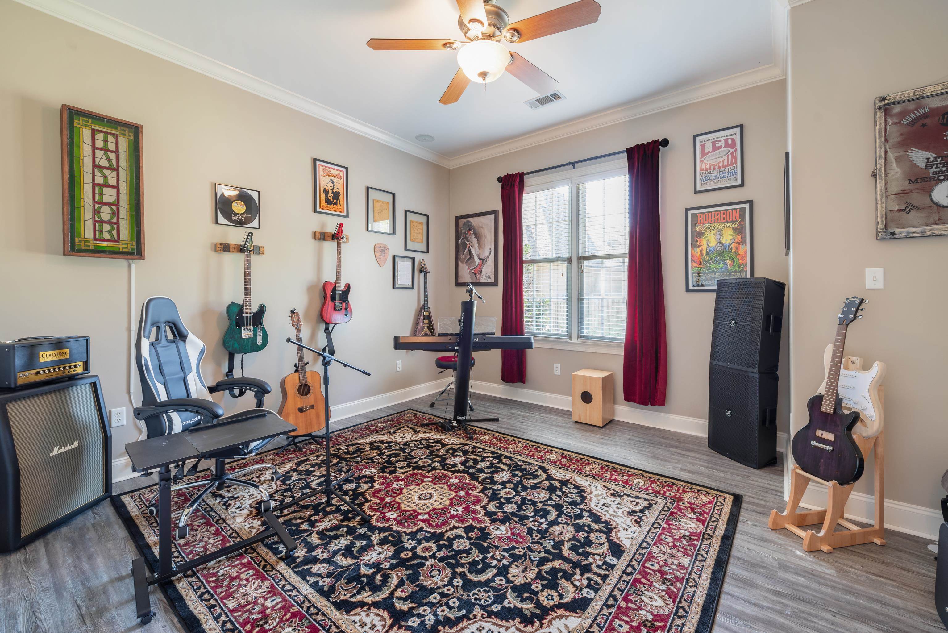 Workout room featuring ceiling fan, hardwood / wood-style flooring, and crown molding