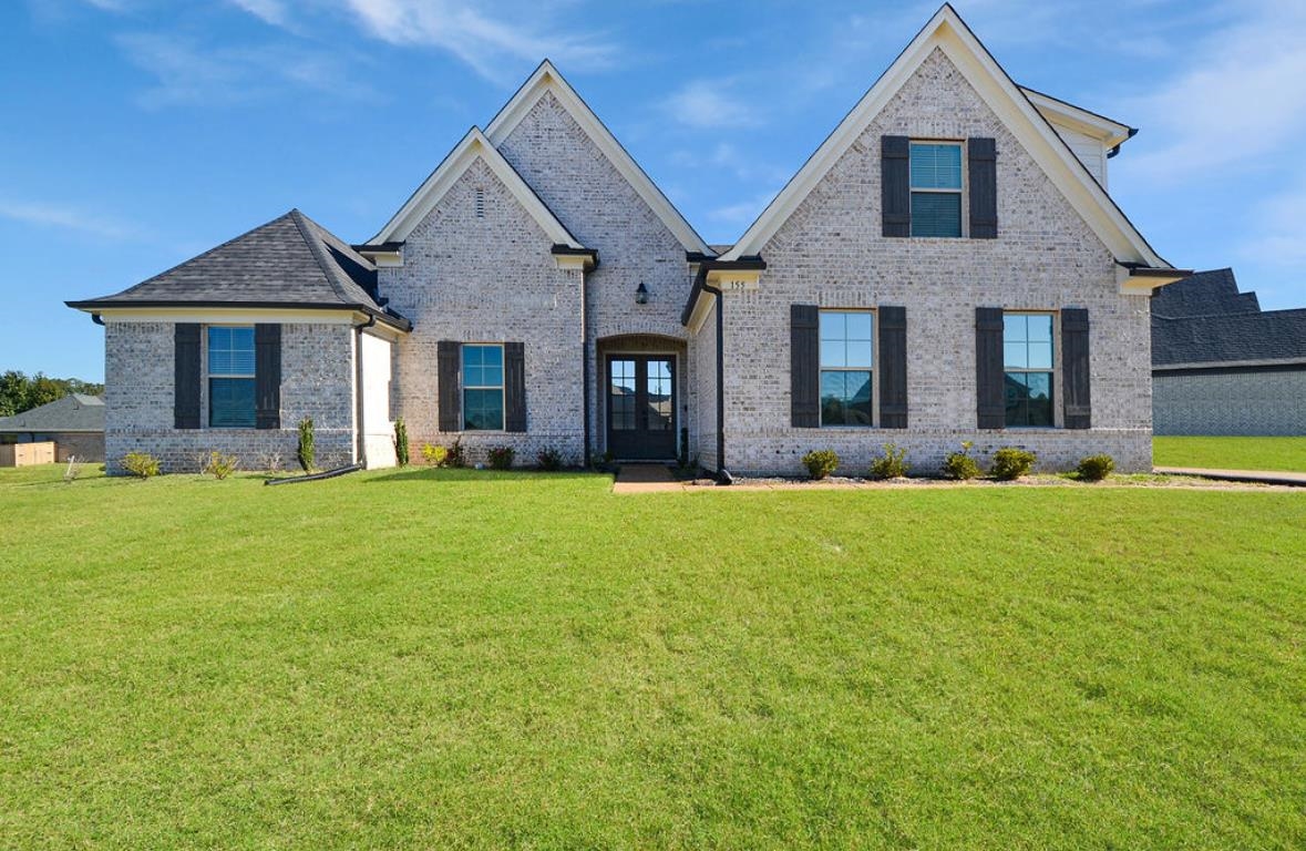 View of front of property with a front yard