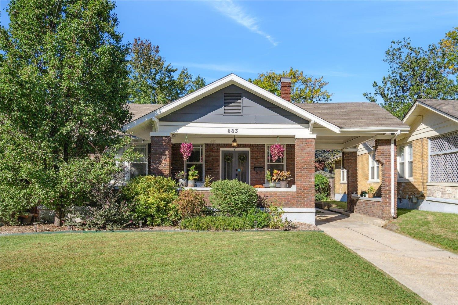 Bungalow featuring a porch and a front yard