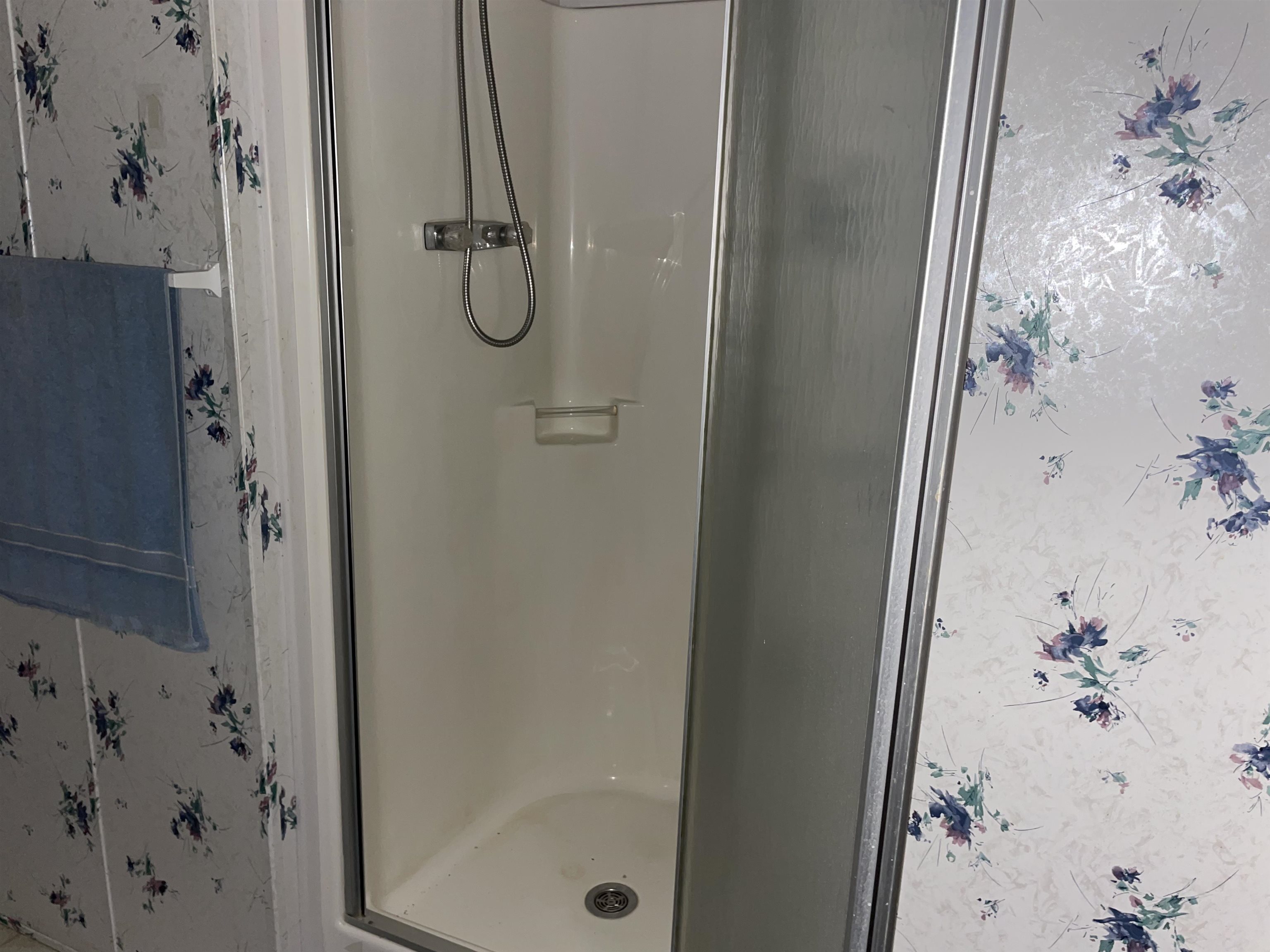 Bathroom featuring a shower with shower door