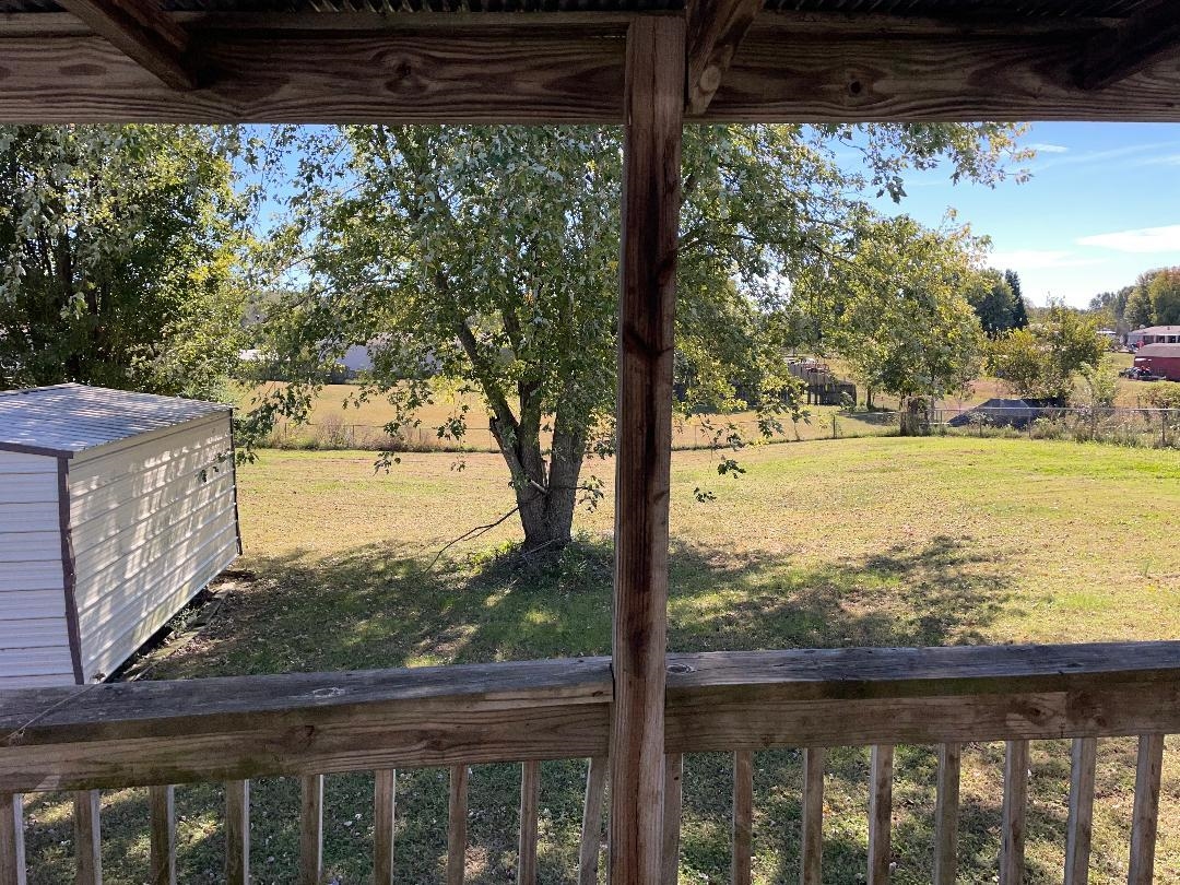 View of yard with a storage shed