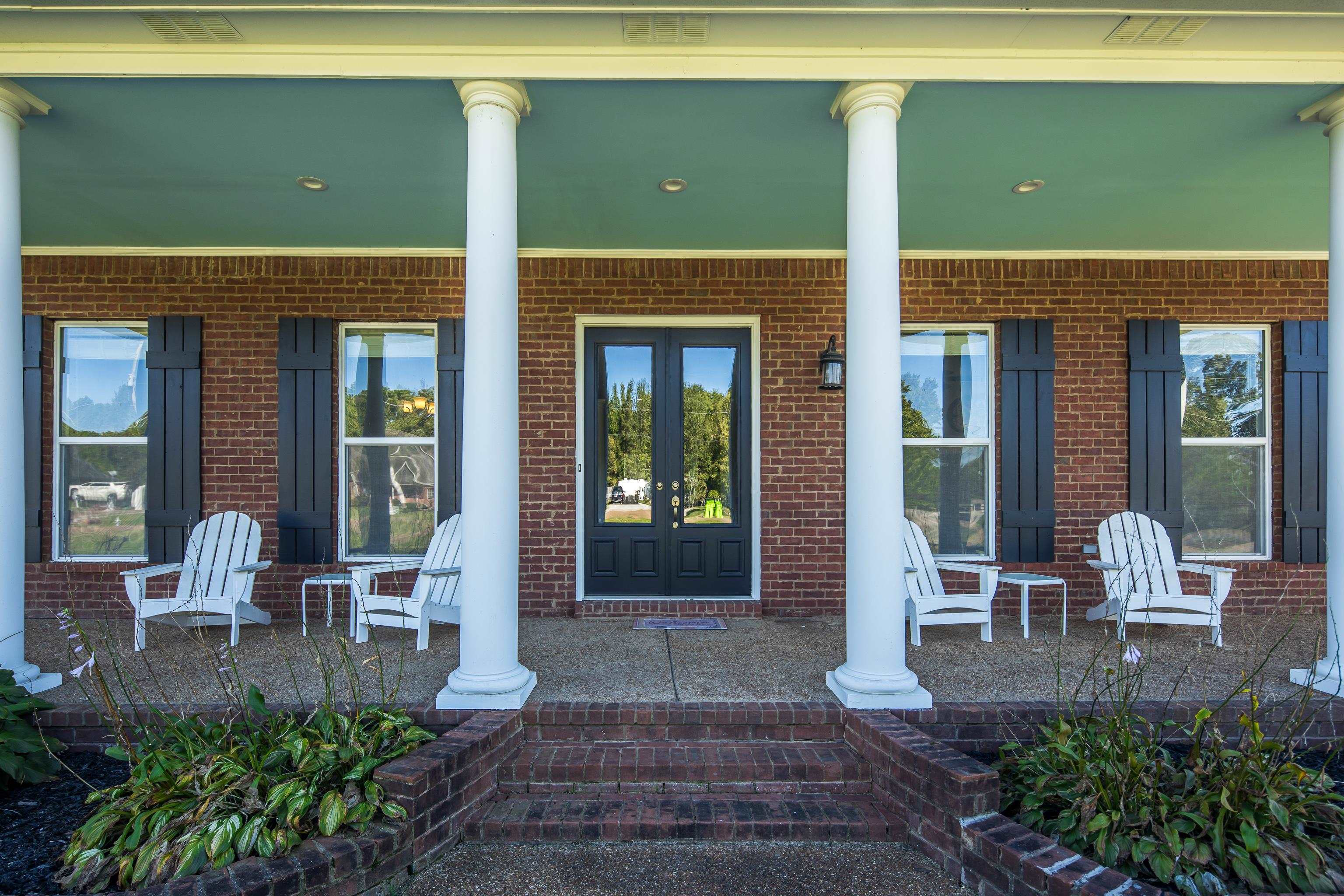 Entrance to property featuring a porch