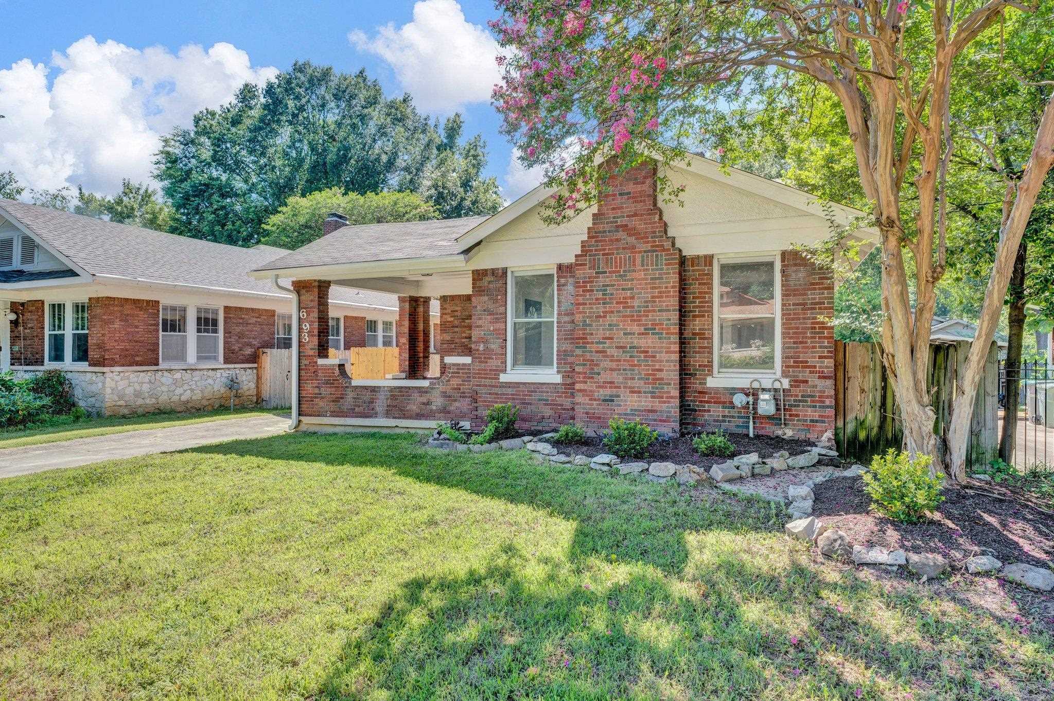 Ranch-style home with a front yard