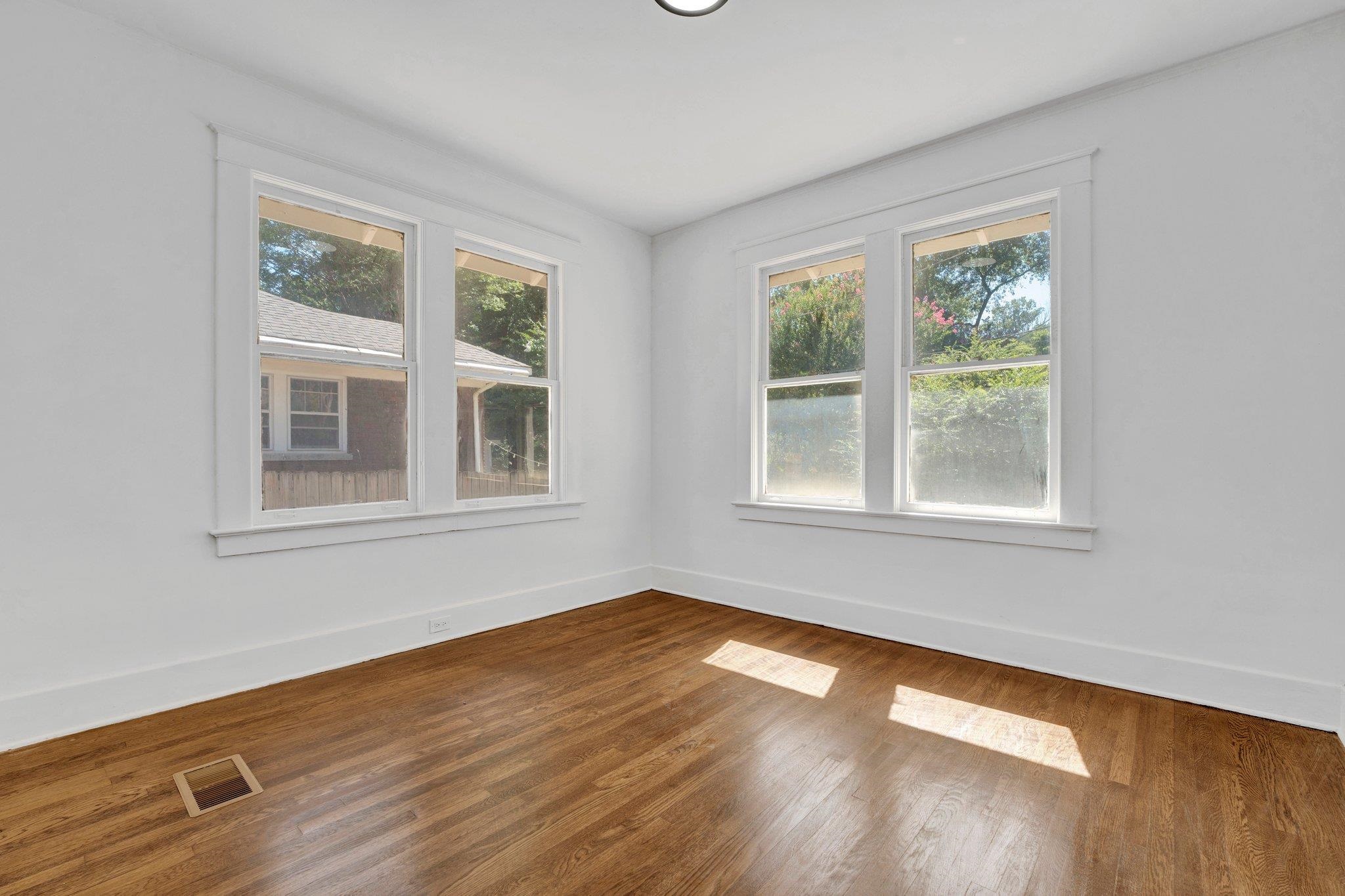 Unfurnished room featuring hardwood / wood-style flooring