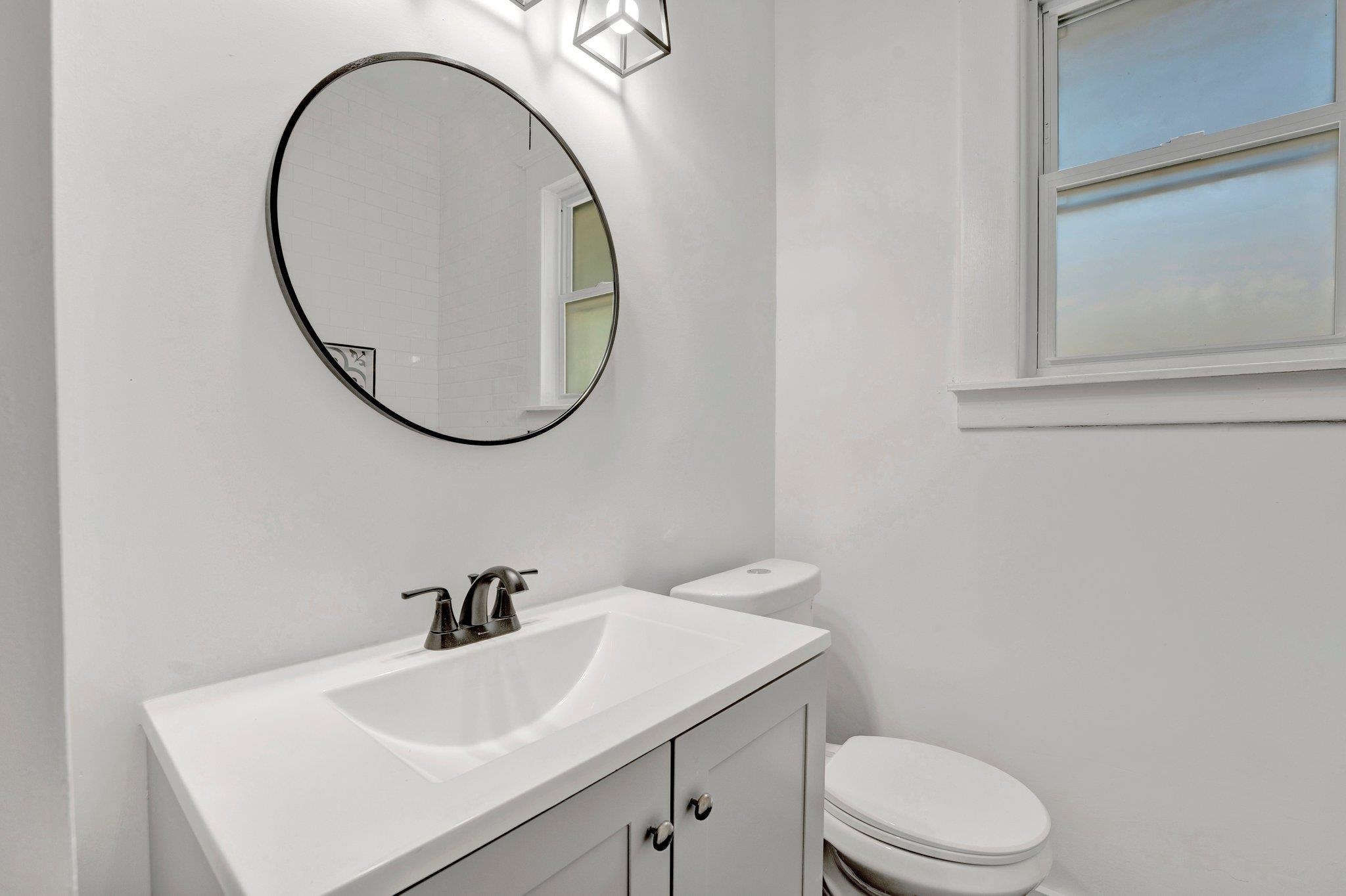 Bathroom with vanity and toilet