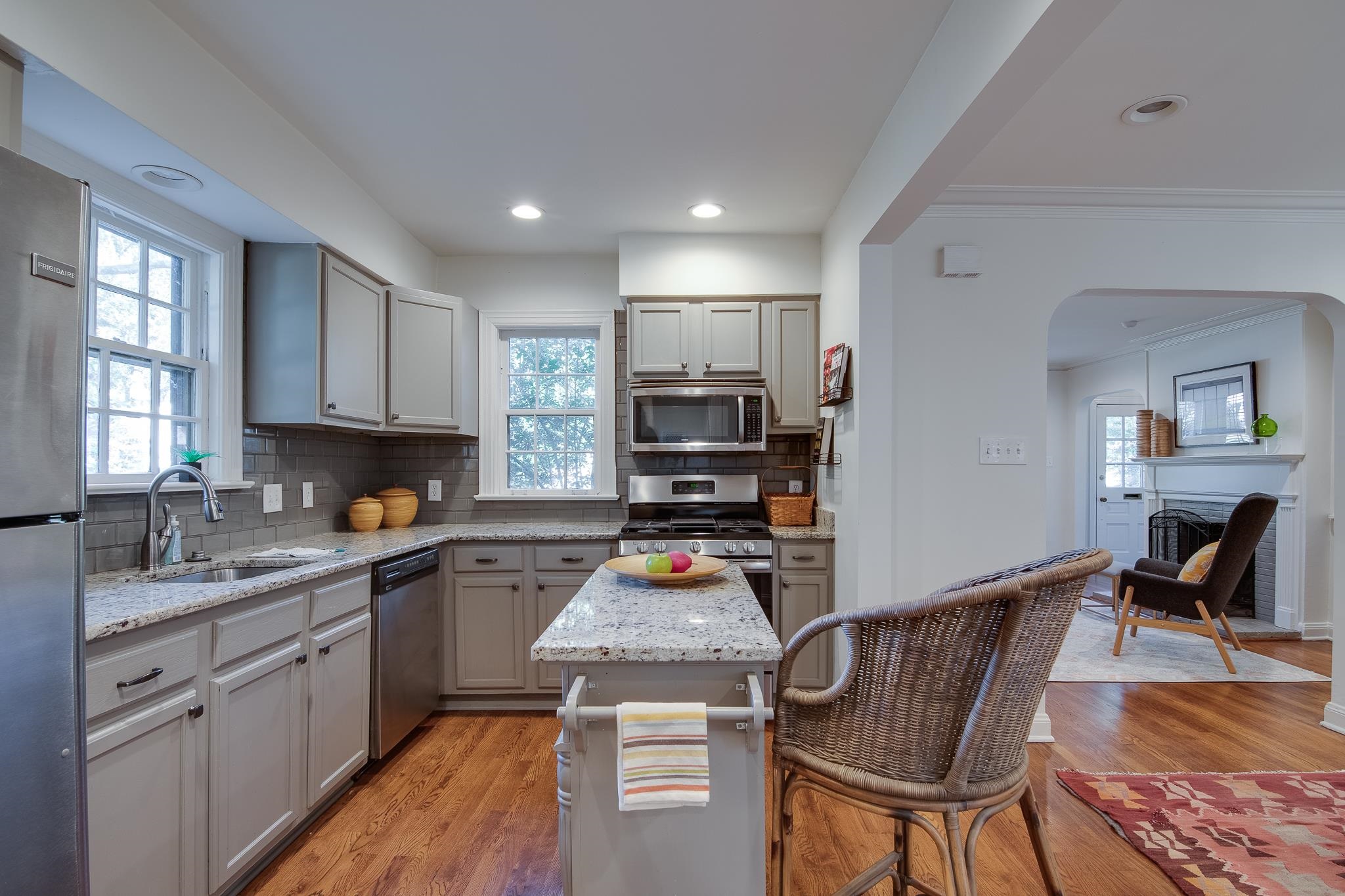 Kitchen featuring plenty of natural light, appliances with stainless steel finishes, a center island, and light wood-type flooring