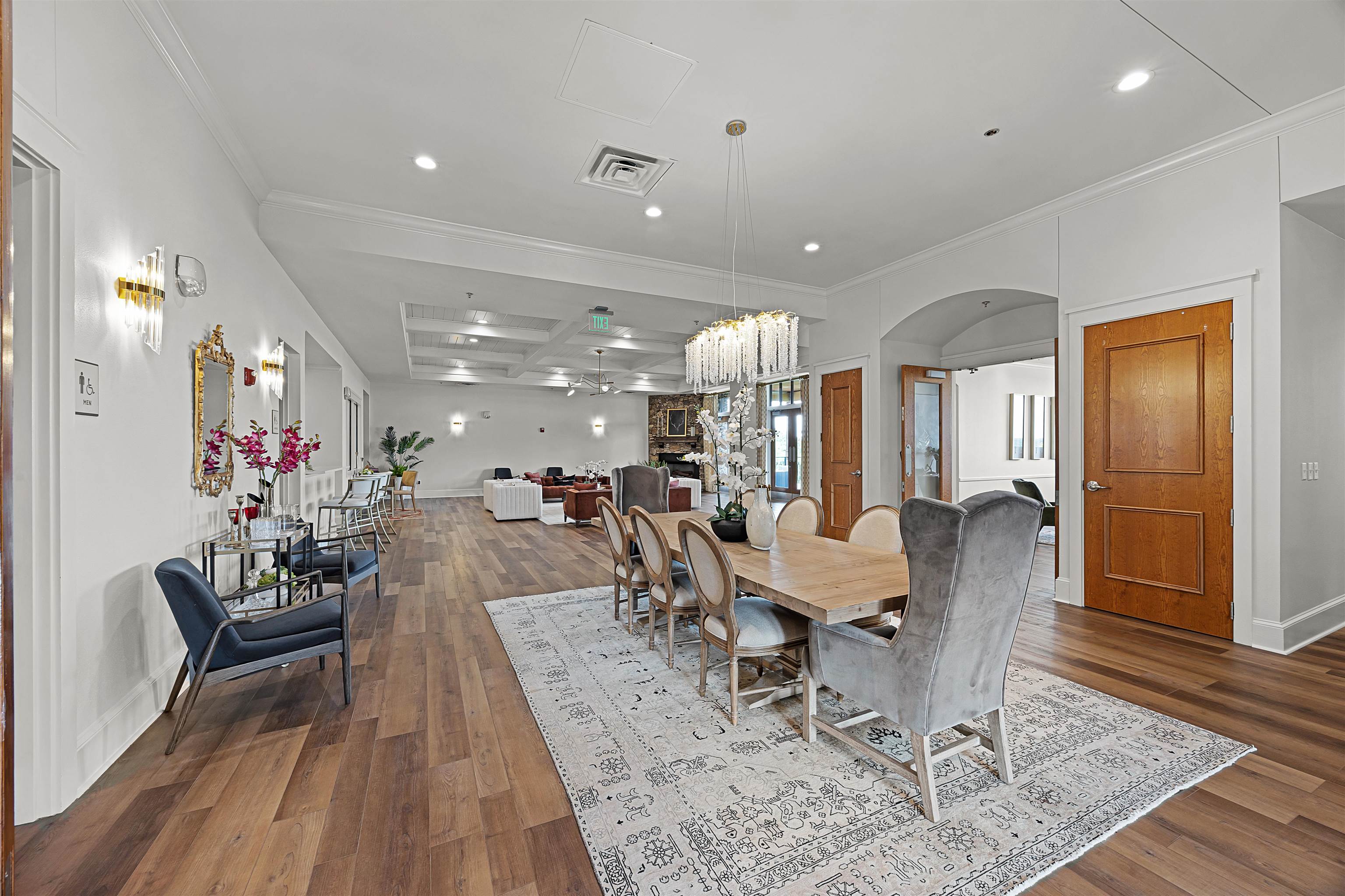 Dining area with crown molding, beam ceiling, hardwood / wood-style floors, and coffered ceiling