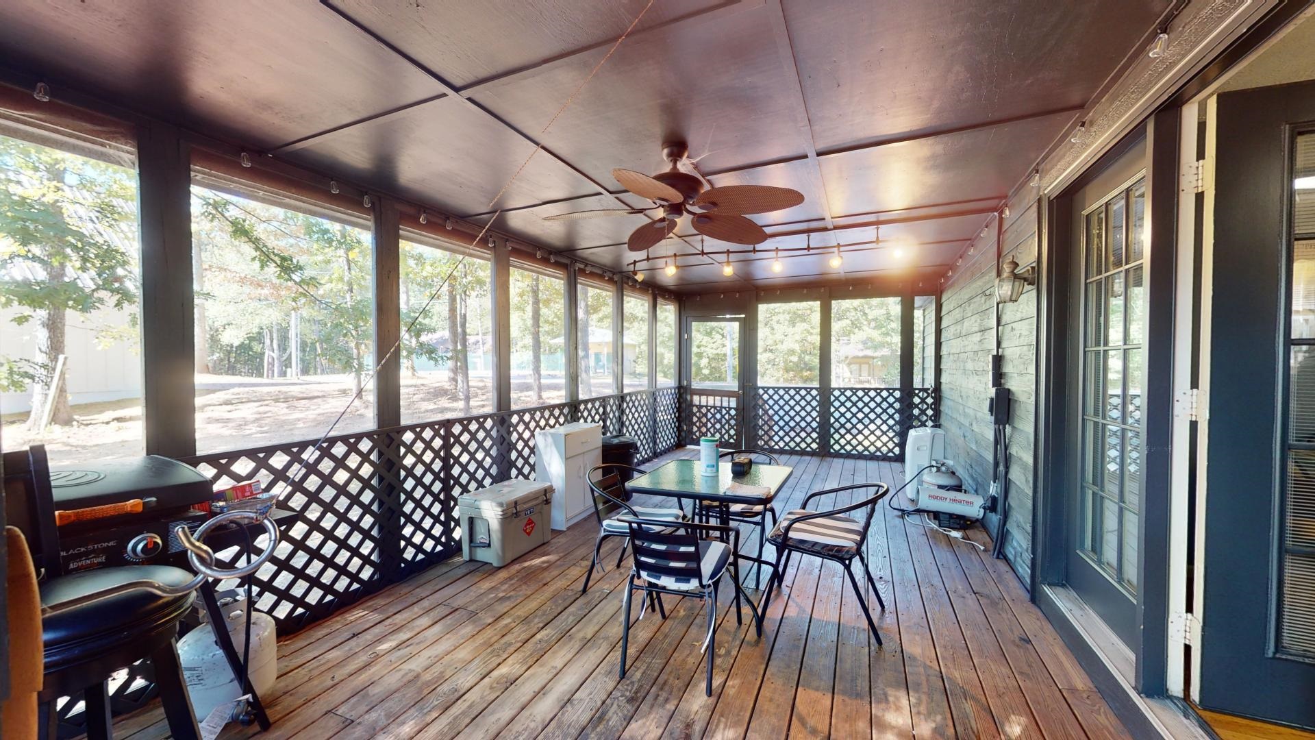 Sunroom featuring ceiling fan