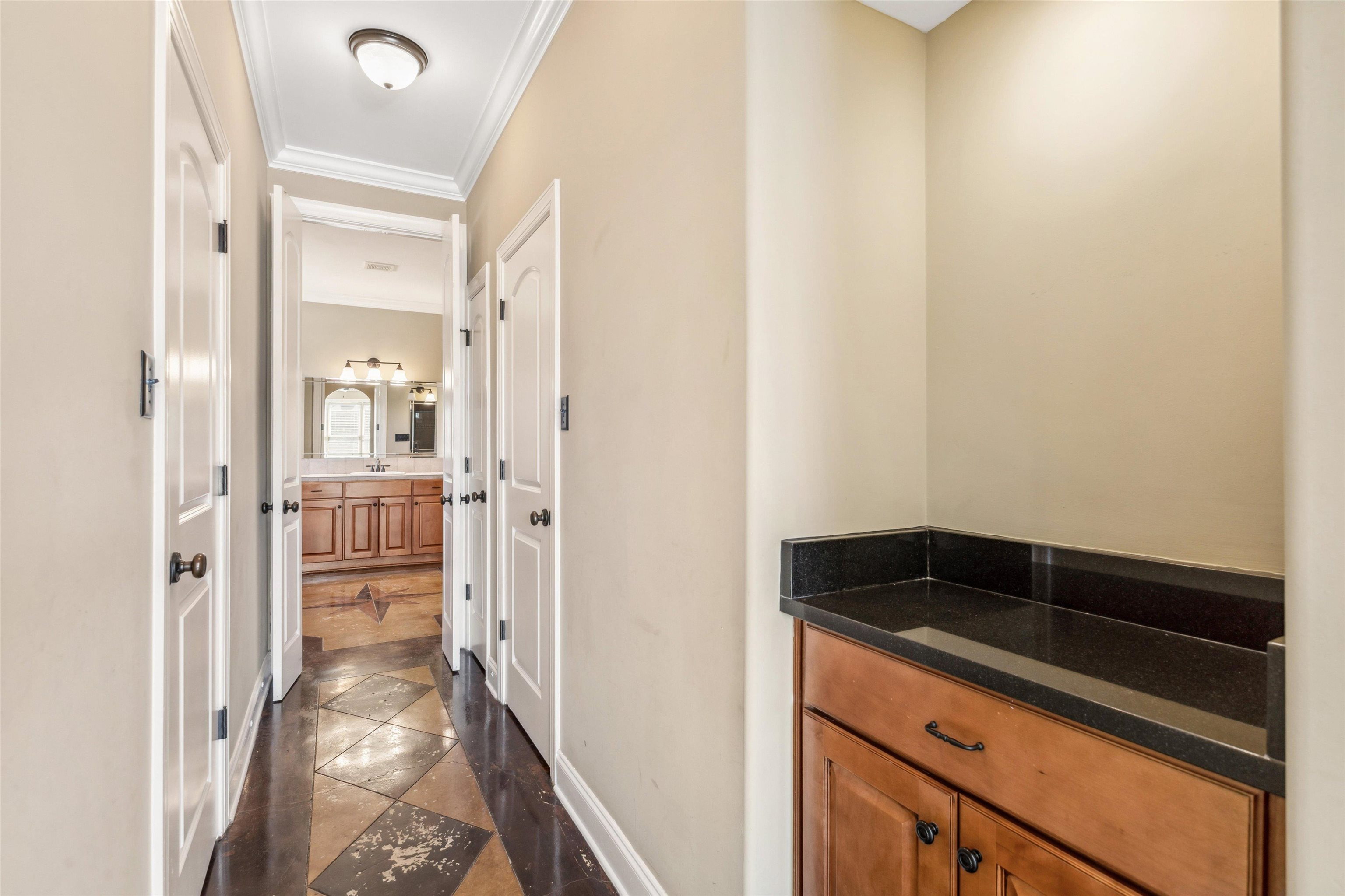 Bathroom with vanity and ornamental molding