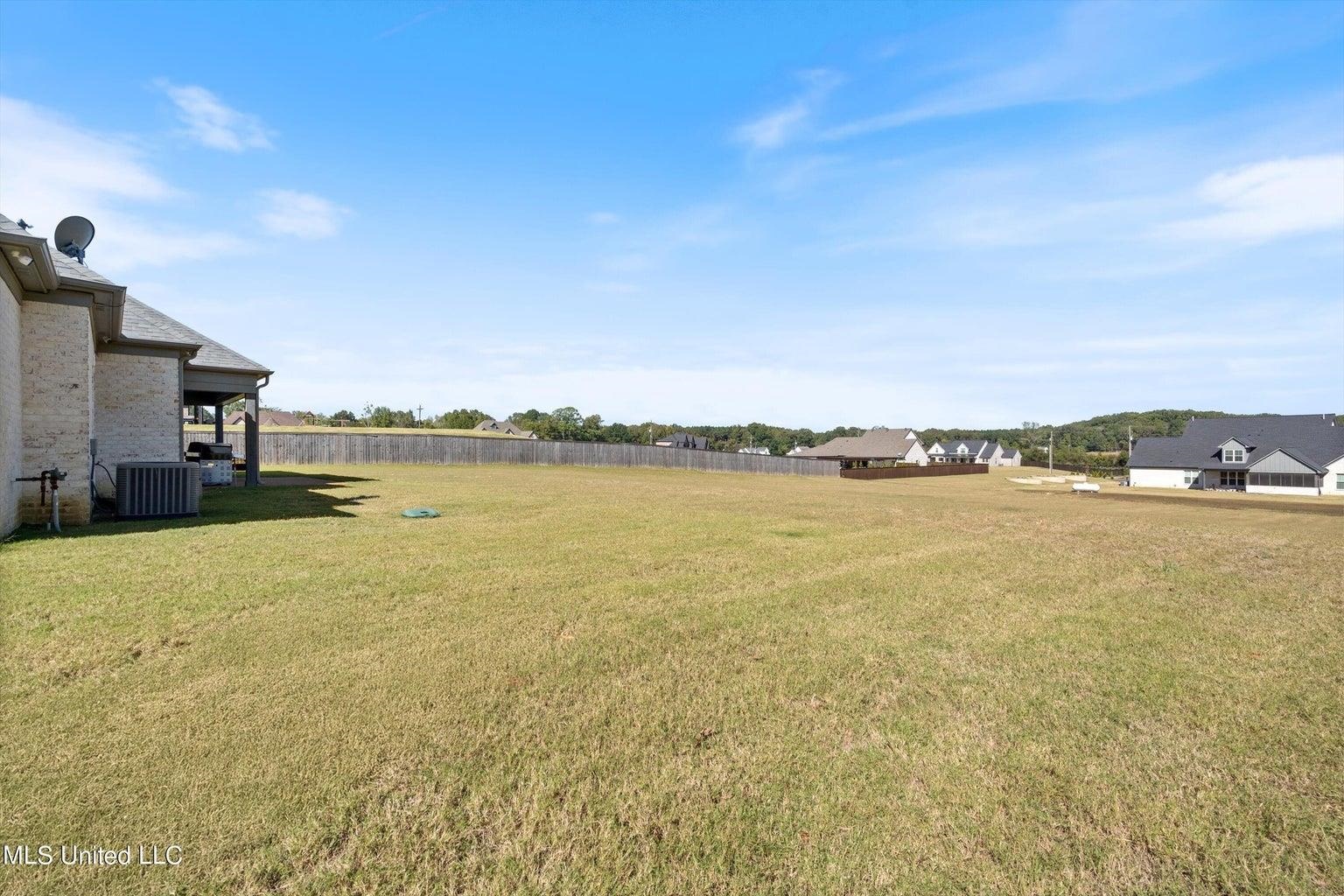 View of yard with central air condition unit