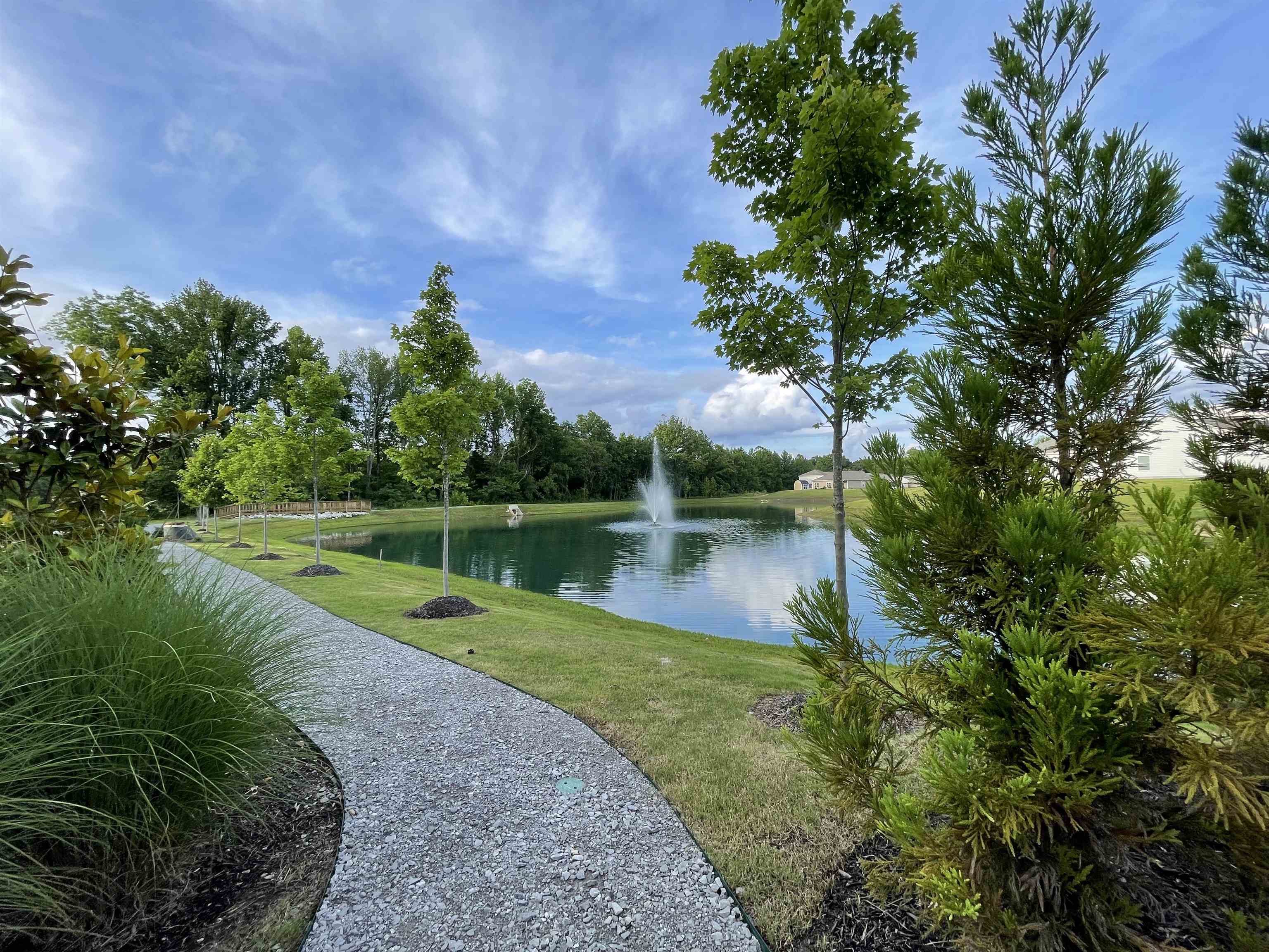 Exterior space with a lawn and a water view