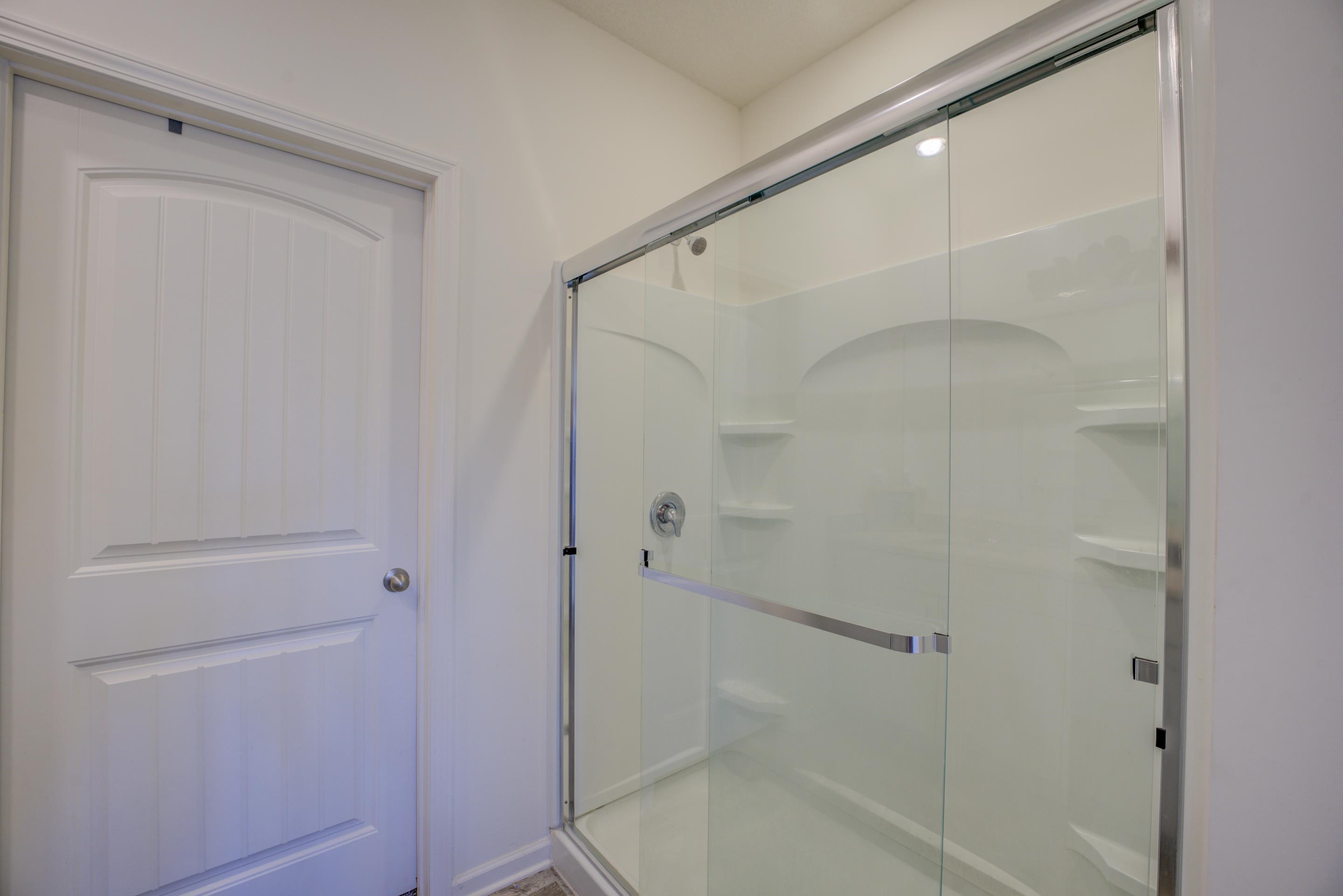 Bathroom with a shower with door