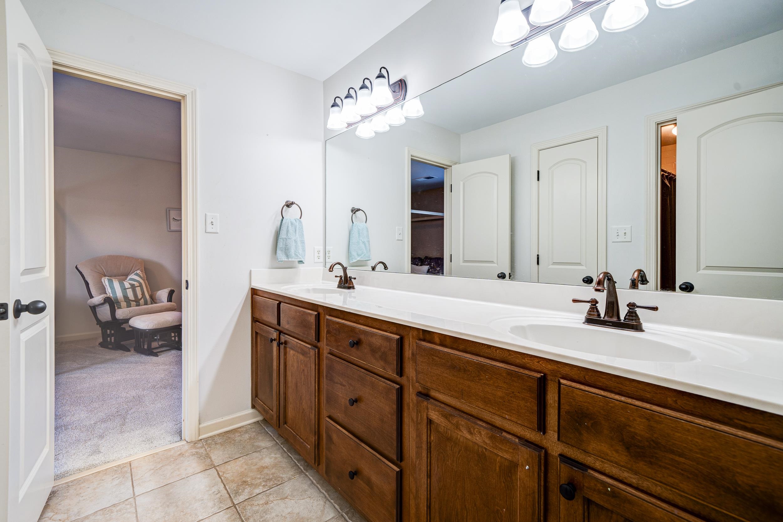 Bathroom with vanity and tile patterned flooring